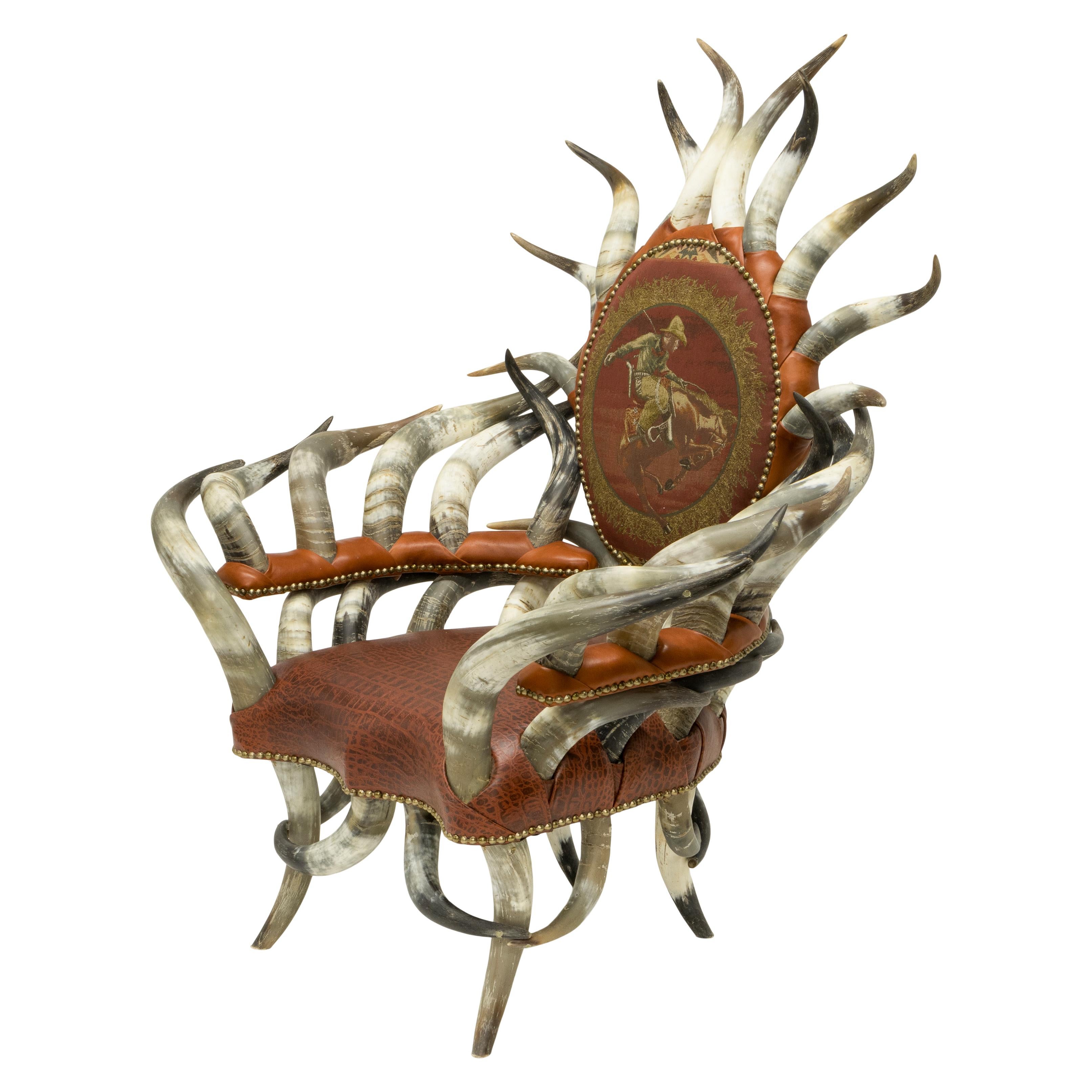 Custom made oversized horn chair with leather seat and fabric back. This is incredible chair is constructed from 42 matching steer horns. Legs and armrests are crafted from the horns with a crown of horns around the back. Leather is a warm brown