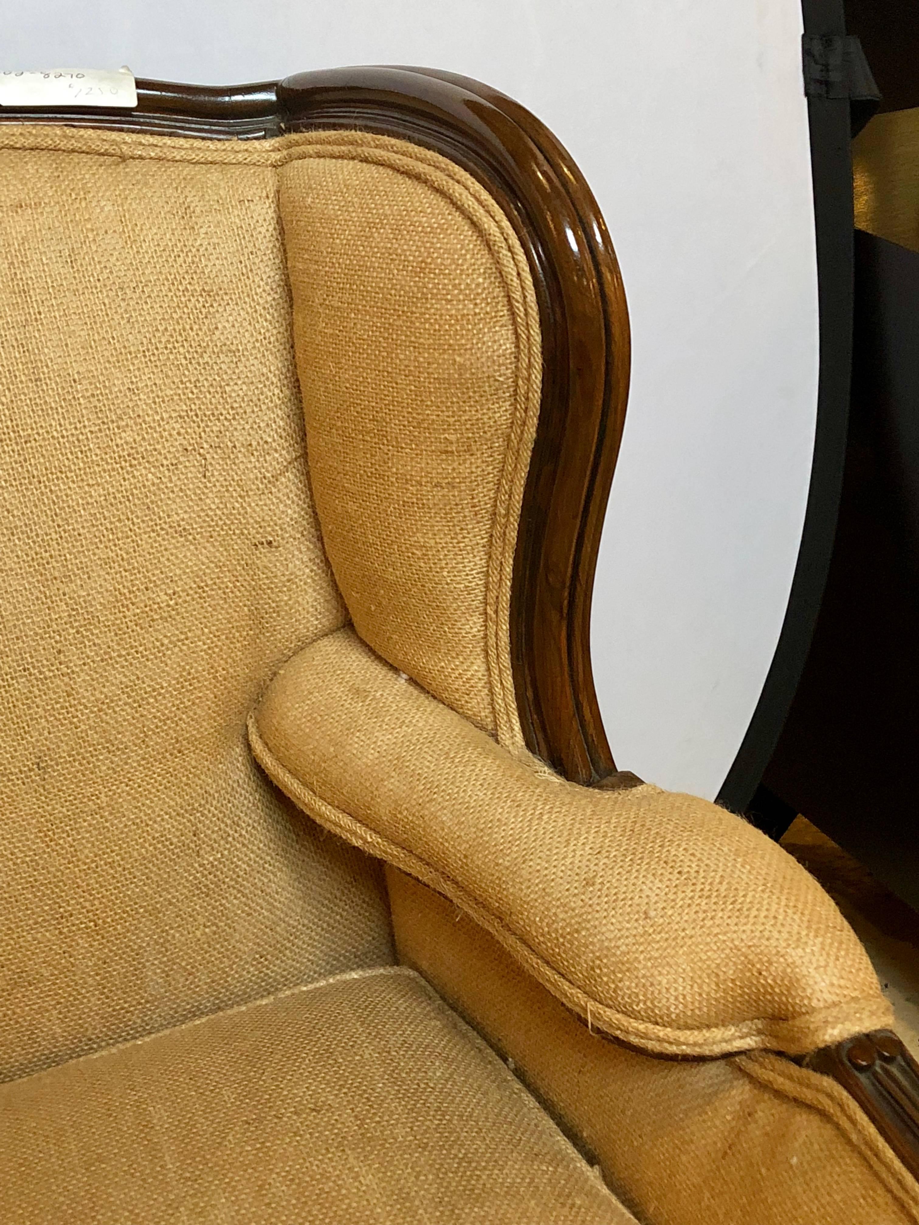 Oversized wingback chair upholstered in burlap carved wood details. Louis XV in style in a new fabric.