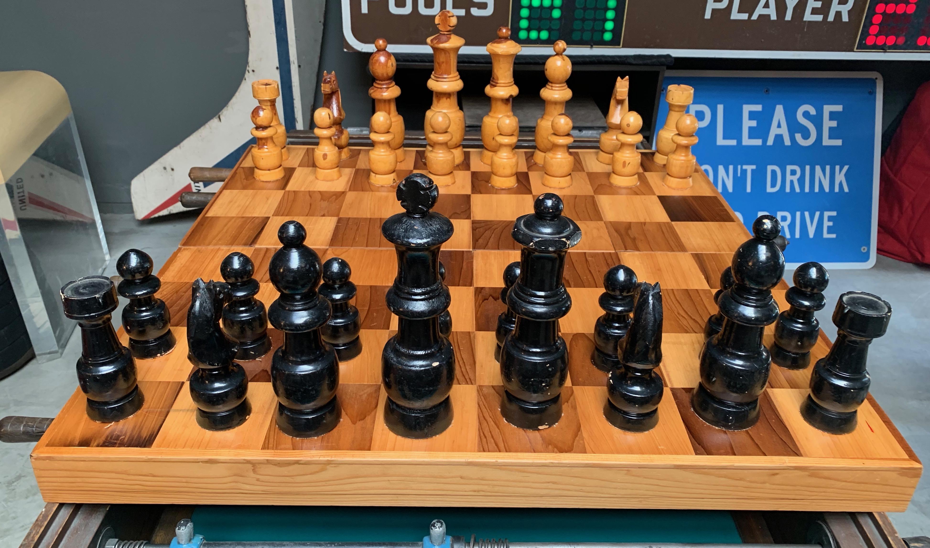 Massive oversized wood chess set. Box unfolds into chess board. Board newly cleaned. Great vintage condition.

For reference, size of King is 10