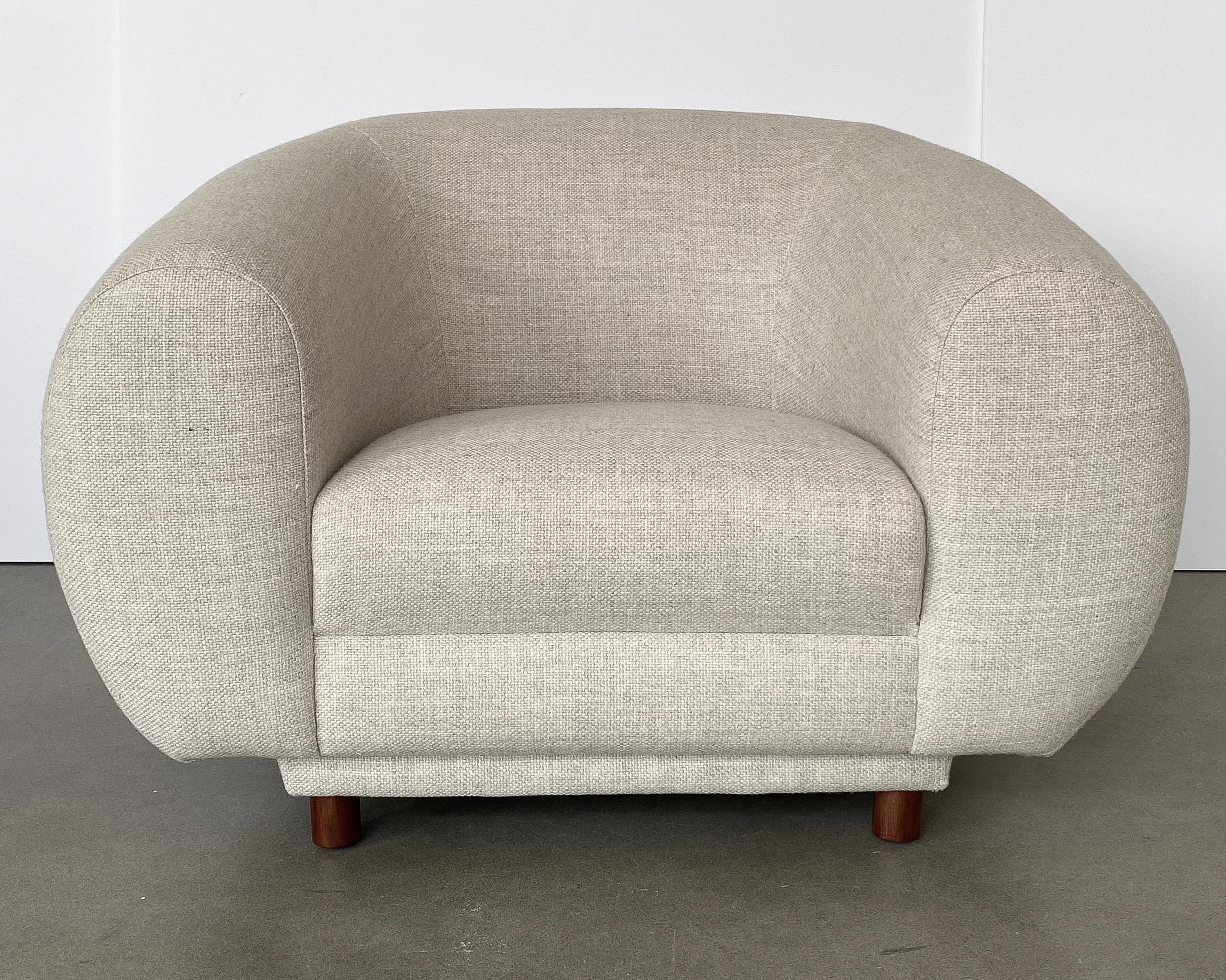 An overstuffed Mid-Century Modern polar bear inspired lounge chair.  Newly upholstered in a very soft basket-weave fabric with natural striations. The fabric is a warm light stone color. A fabric swatch is available upon request. All new foam