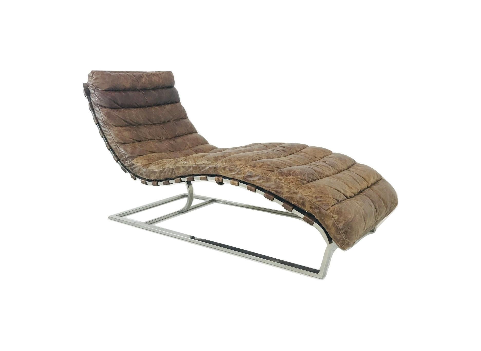 This stylish modern chaise lounge chair features channeled brown leather with a distressed patina situated on a chrome base. Comfortable lounge design makes this an excellent seating option for home or office. 