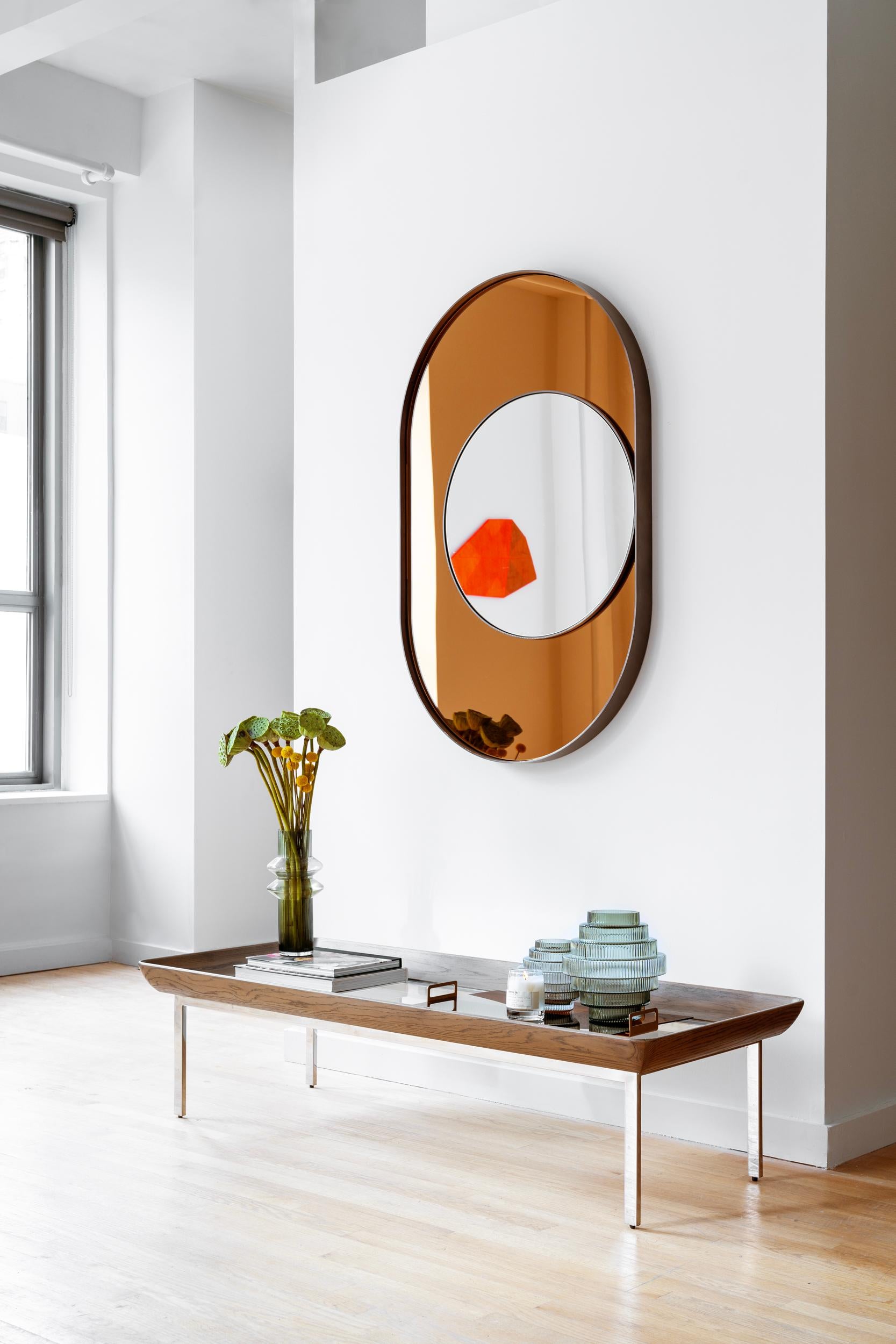 No. AC-008

The inspiration behind the Ovo Mirror Collection (Arc, Ellipse, and Trapezoid mirrors) was conceived by Lauren's fascination with early light and space artists who often hid mirrors within their work to manipulate the