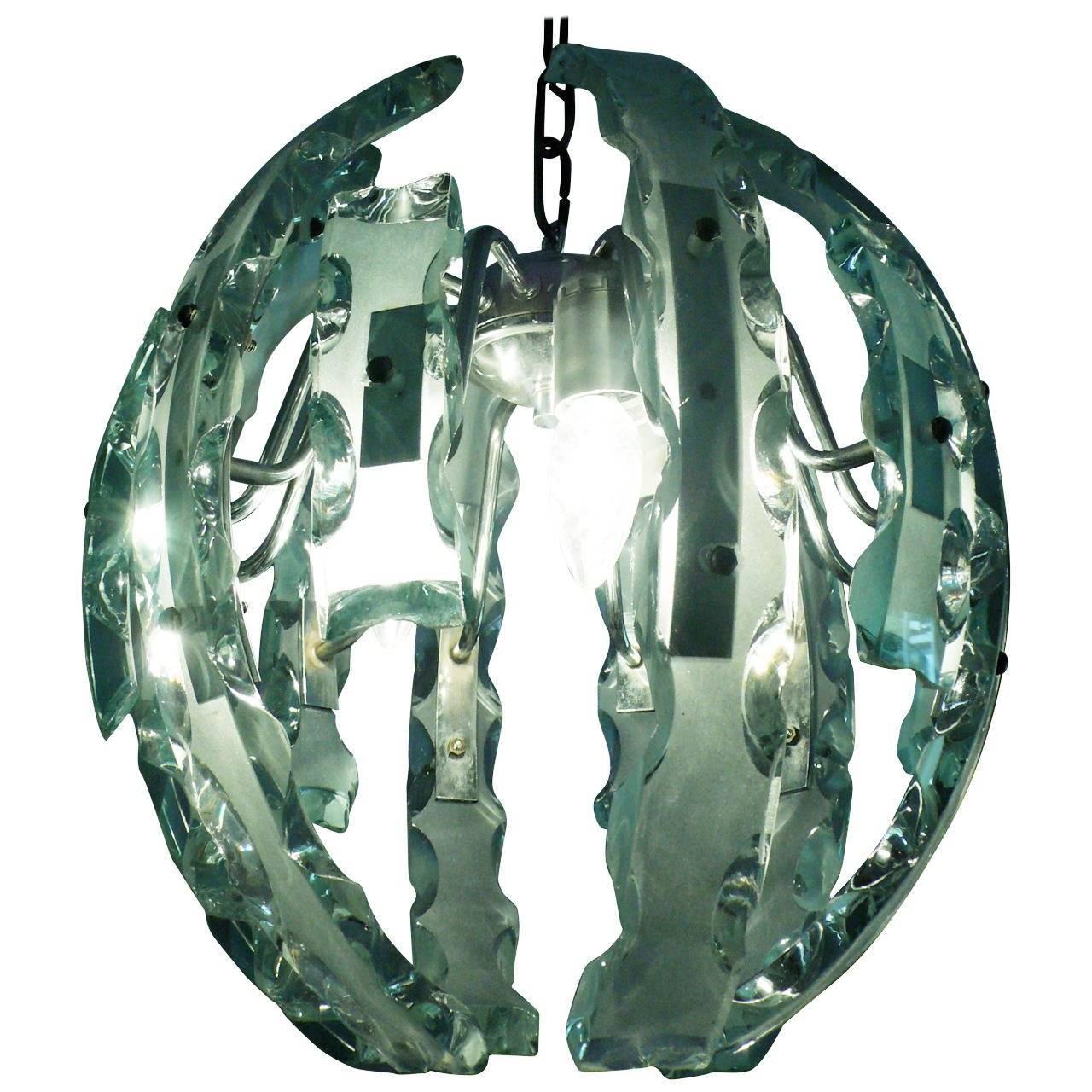 Extraordinary pendant in the shape of a large egg Fontana Arte style. Twelve carved glass Verde Nilo color.