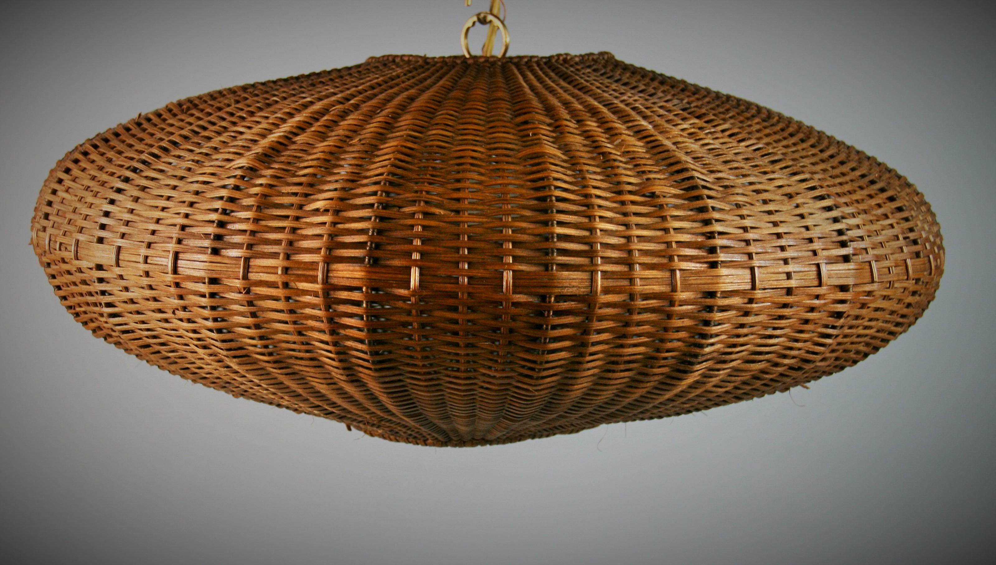 3-513 Oversized ovoid shaped wicker pendant
Takes one 100 watt Edison based bulb
Supplied with 3 feet brass chain and canopy
Rewired.
 