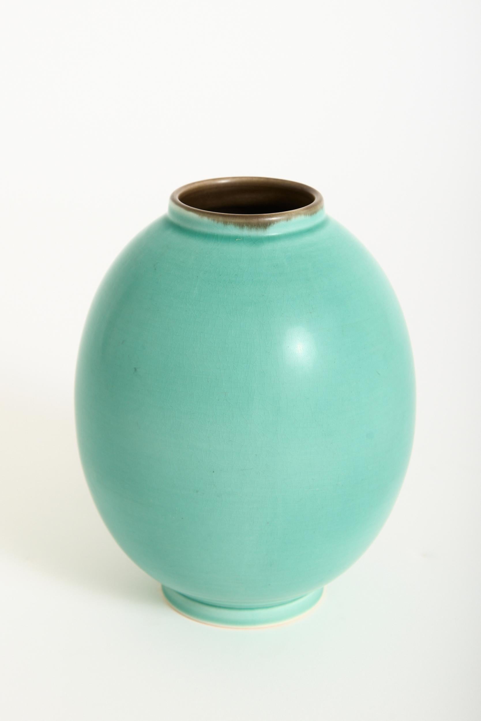 A green ovoid 'Bremerholm' vase by Aluminia.
Stamped and inventory numbered. 
Denmark, Circa 1931
