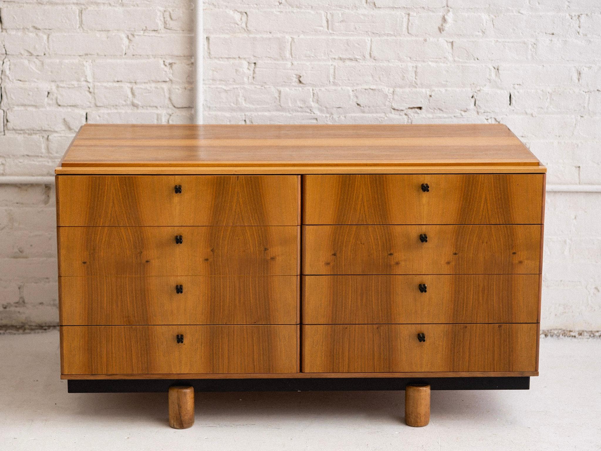 A mid century Italian sideboard cabinet by Gianfranco Frattini for Bernini. Model “807,” this pieces features 8 drawers, blonde wood and black Bernini branded hardware. Designed to be used alone or in tandem with other units from the “Ovunque” line.