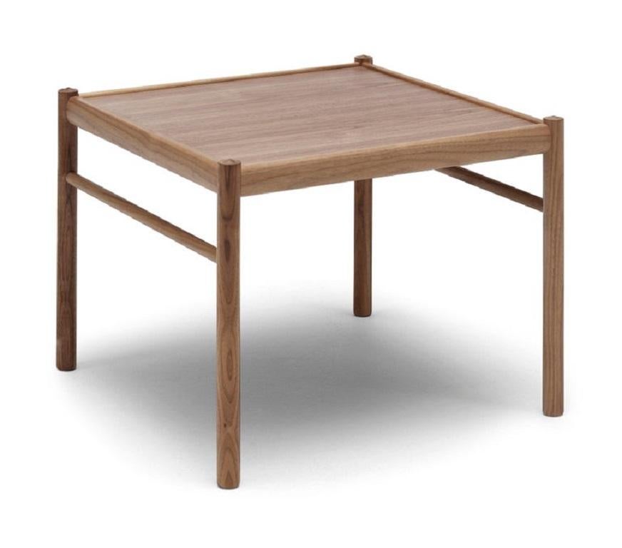 The OW449 Colonial coffee table was designed by Ole Wanscher and clearly communicates his desire to lend modern style and clever utility to Classic objects. The square veneer tabletop and framing design reflect that of the other furniture in the