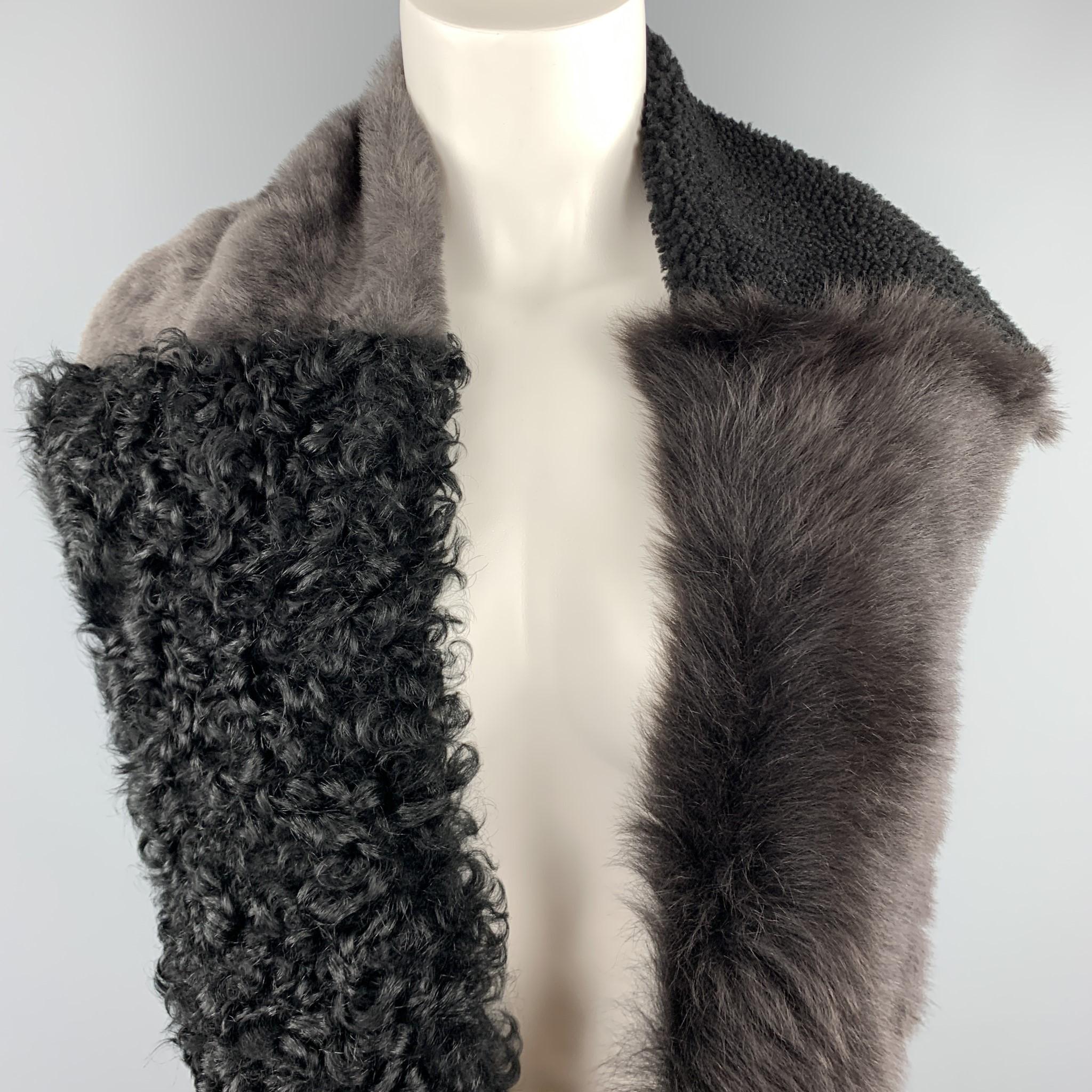 OWEN BARRY circle scarf comes in patchwork panels of black shearling and various furs. Handcrafted in Great Britain.

Excellent Pre-Owned Condition.

Length: 52 in.
Width: 7.5 in.
SKU: 102513
Category: Scarves

More Details
Brand: OWEN