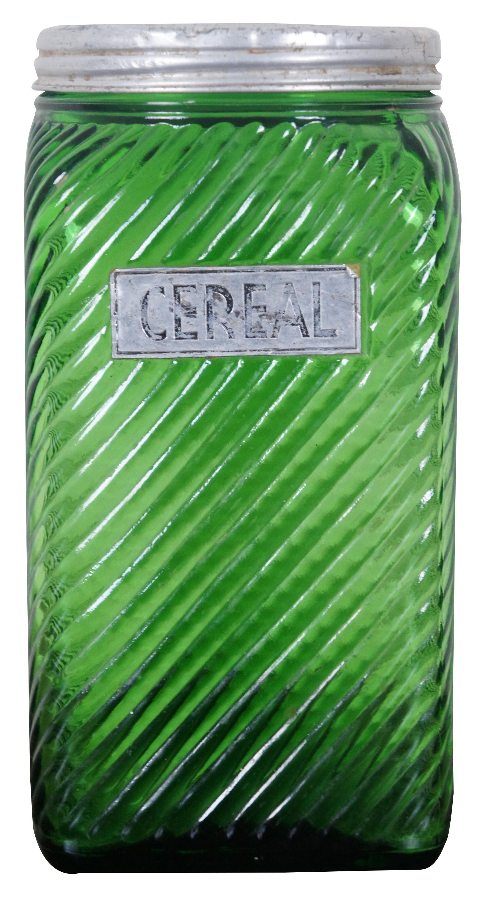 Antique Owens-Illinois green glass canister with diagonal ribs, Cereal label and metal screw top lid.