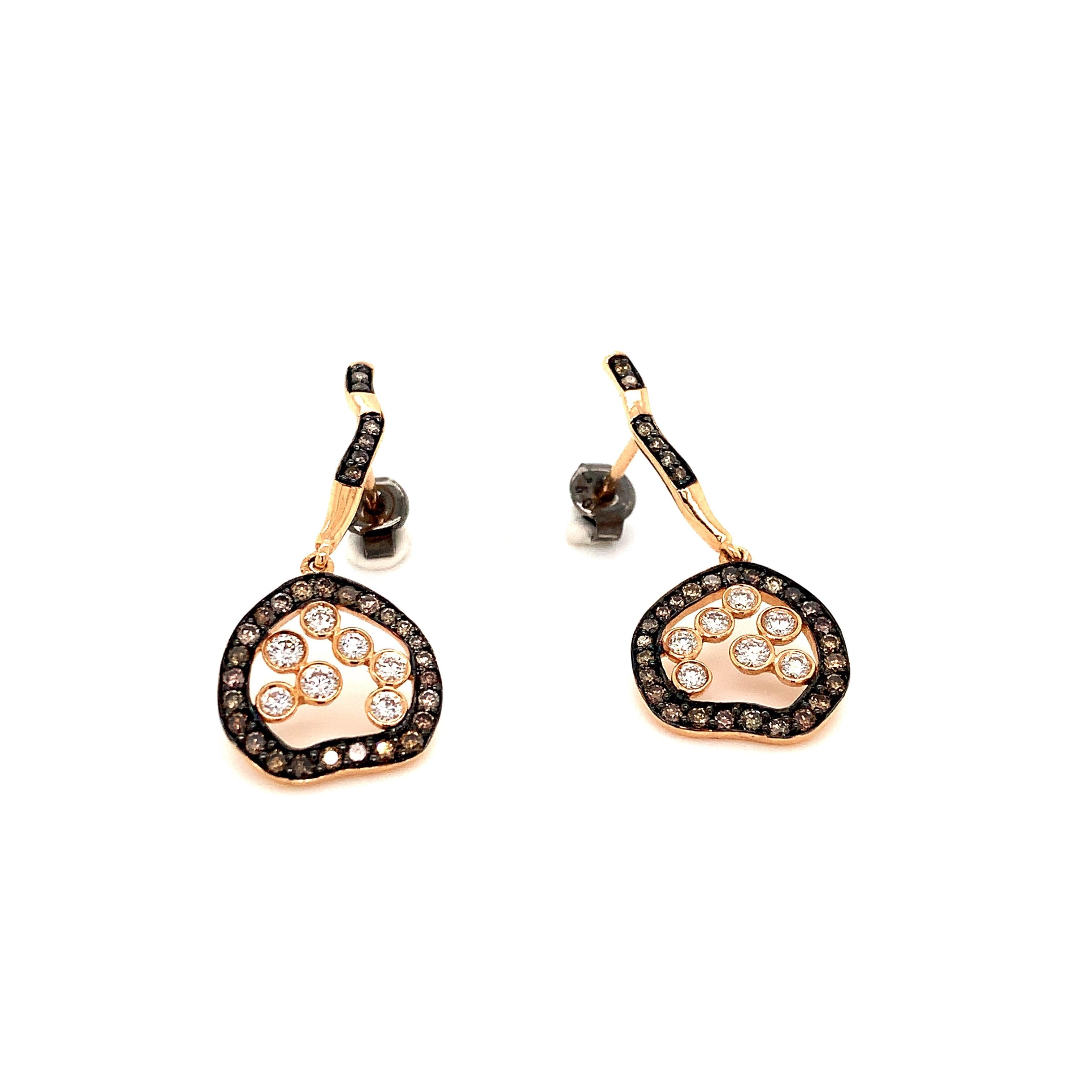 OWN Your Story 18K Rose Gold White and Cognac Diamond Inverse Circular Sign Contrast Earrings

OWN Your Story brings its 3 generations of family tradition and unparalleled experience with 18K gold, diamonds, and gemstones to create high-level