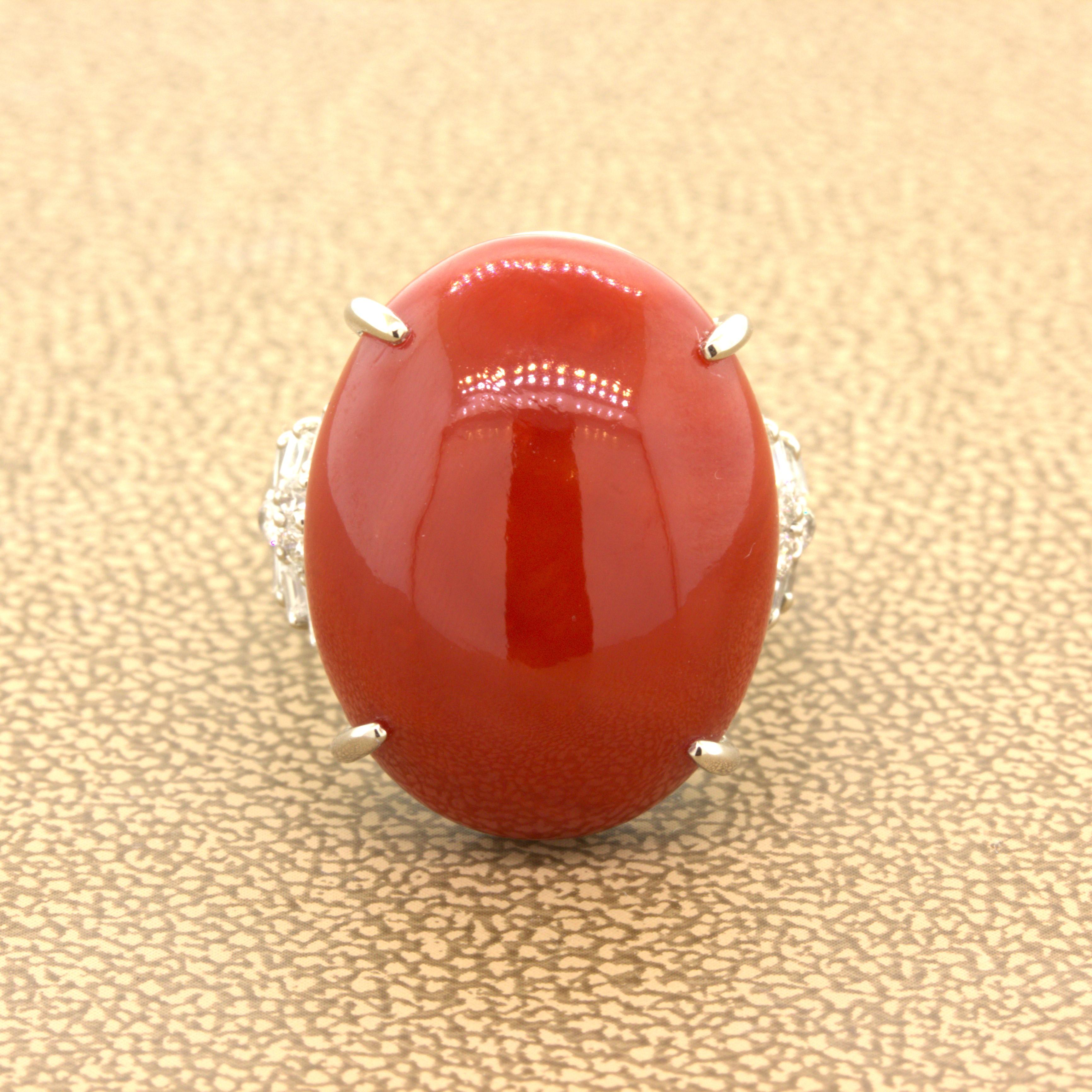 Ox Blood Coral Diamond Platinum Ring

A large and fine piece of natural Italian coral takes center stage. It weighs an impressive 22.06 carats and has a rich intense red color known in the trade as “ox blood” for only the finest quality red coral.