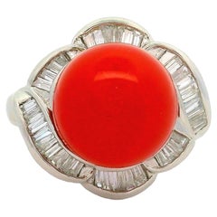 Anello a spirale in platino con diamante e corallo al sangue di bue