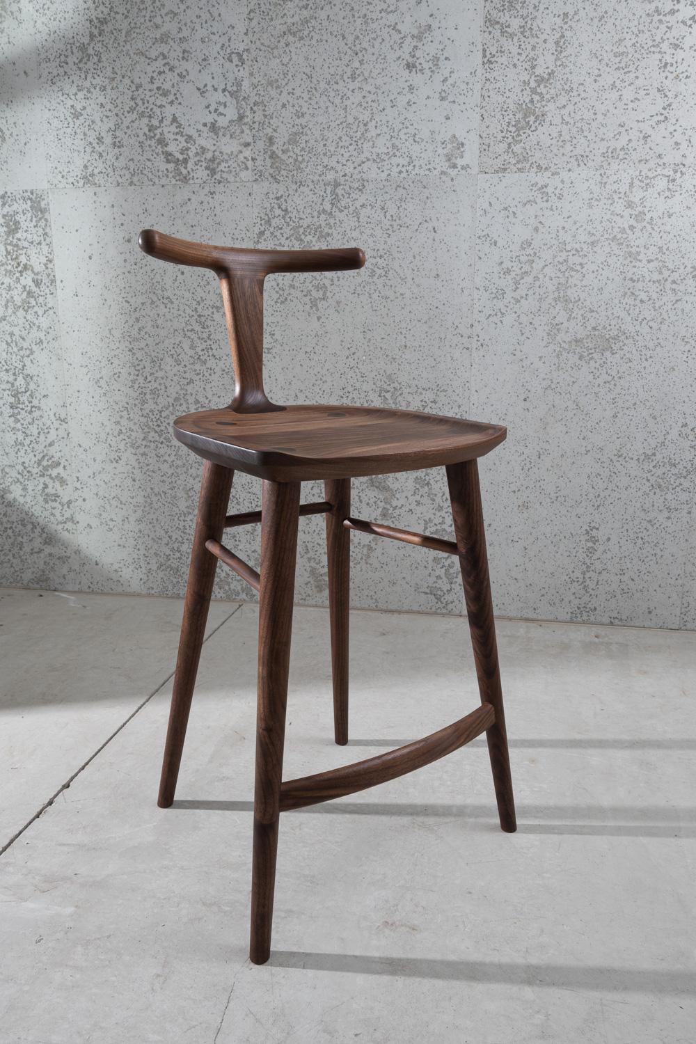 This bar stool, designed by Justin Nelson for Fernweh Woodworking, evolved out of the Oxbend dining chair. The Oxbend collection was born from a desire to create seating that is comfortable, organic, and elegant in its simplicity. This Oxbend stool