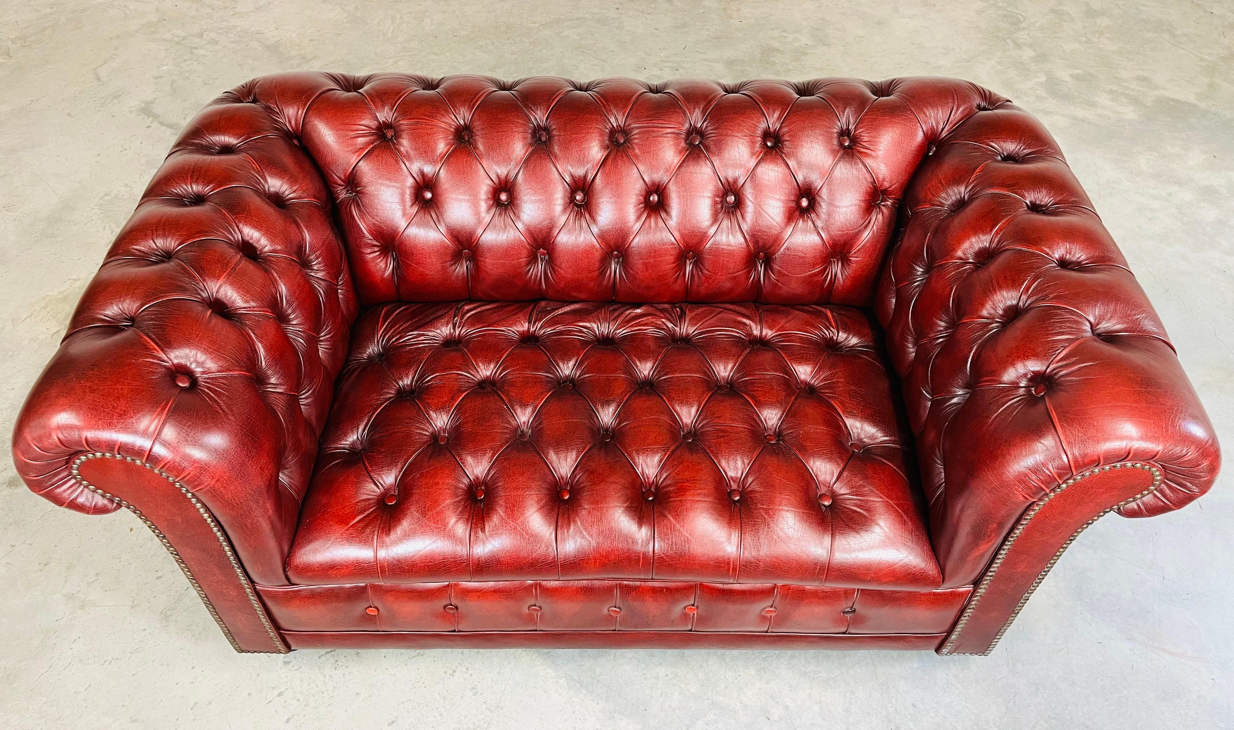 Oxblood Chesterfield Tufted Leather Love Seat Sofa -Great Britain Circa 1970 In Excellent Condition In Southampton, NJ