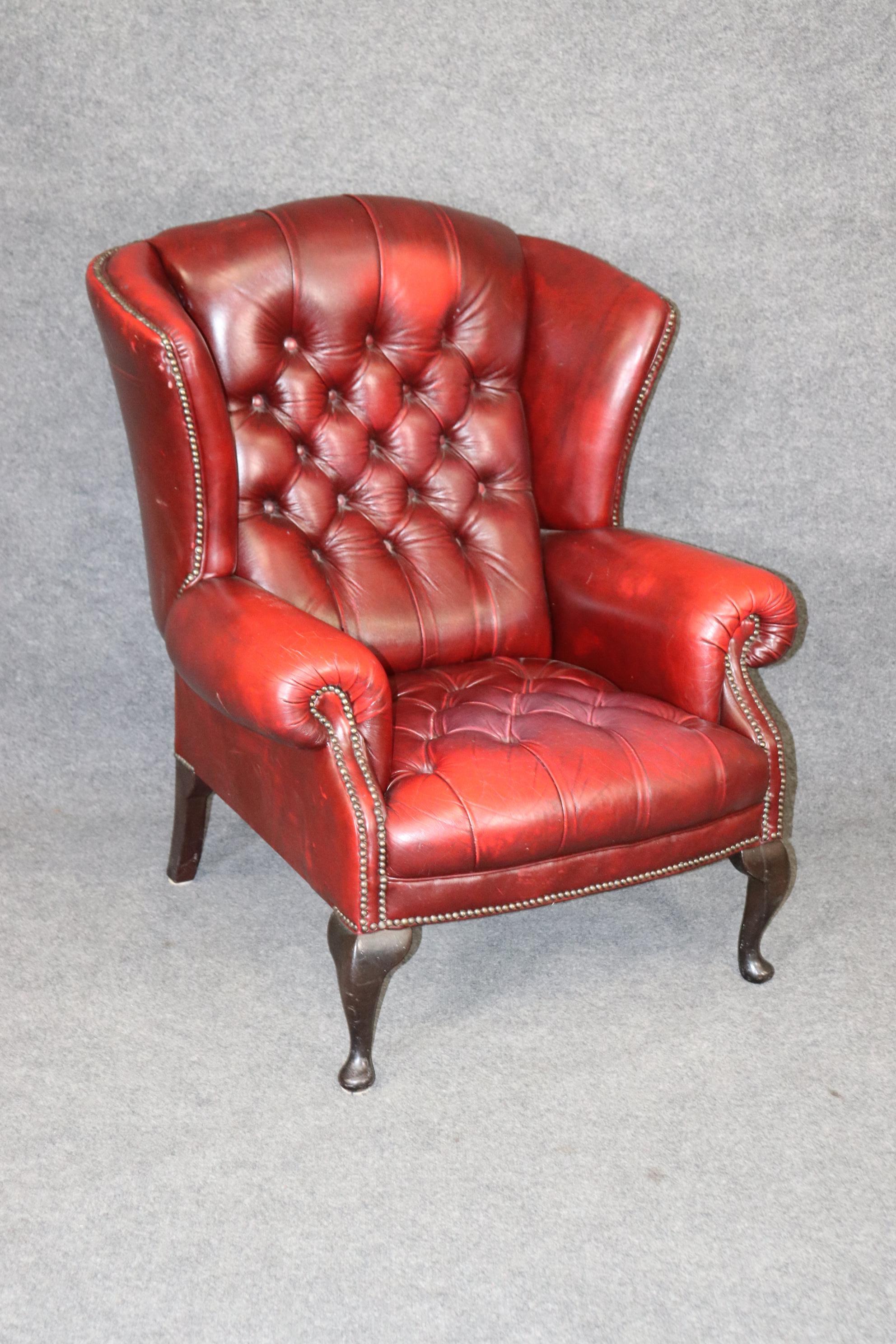 This is a beautiful time-distressed beautifully worn leather armchair in the chesterfield style. The chair has nermous signs of age and wear as can be seen in the photos and actually looks better in person. The chair measures 42.5 tall x 33.5 wide x