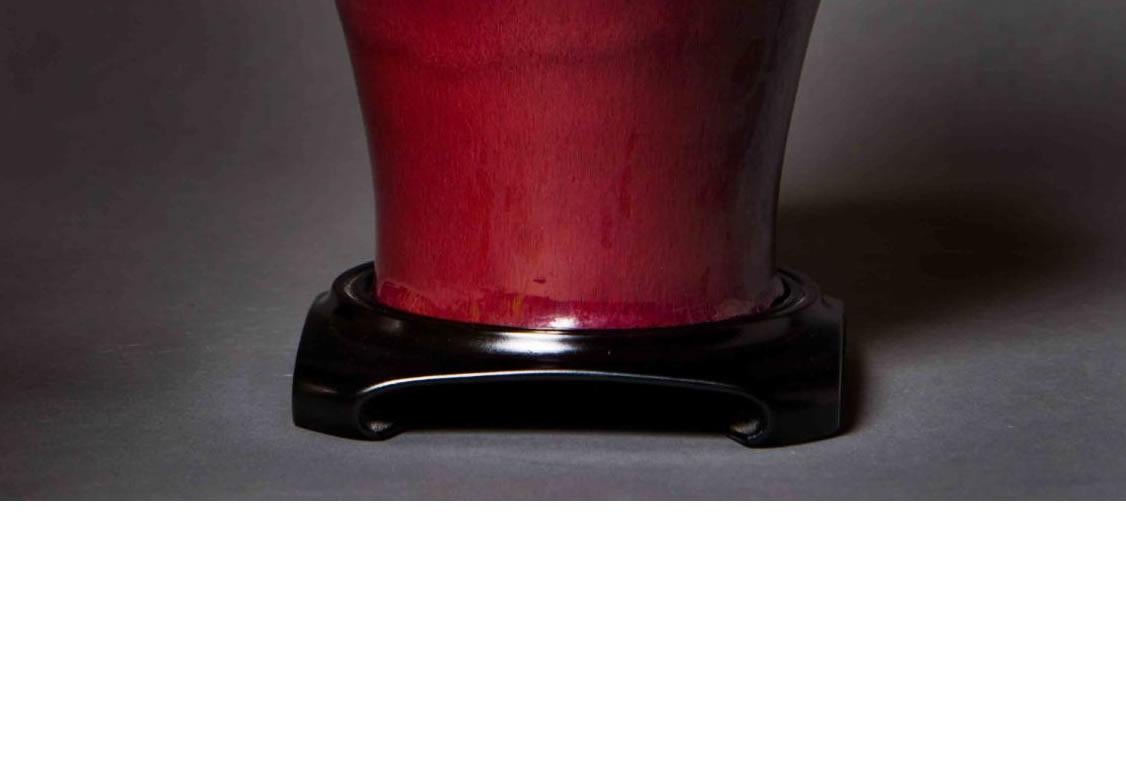 Material: Ceramic 
Origin: China
Age: Ching dynasty, Tung Chih period, circa 1870
Size: 13 inches in height 

We have a nice collection of oxblood vases currently. As well as black Chinese vases.

As designers we plant these vases with