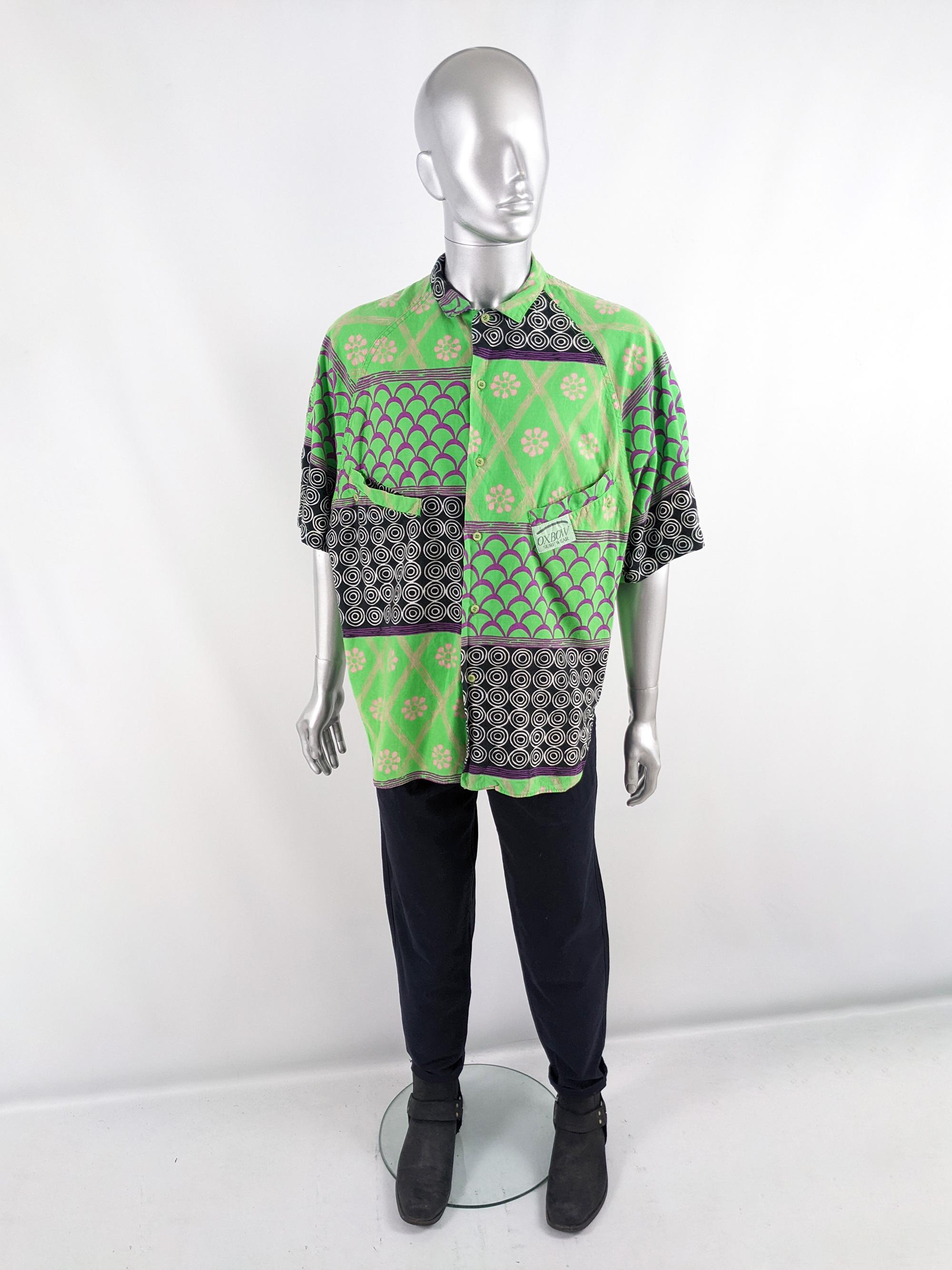 An incredible and bold vintage mens shirt from the late 80s by cult French label, Oxbow. Made in France, from a green, black and purple patchwork printed cotton. It has an oversized fit on top that slightly tapers in towards the bottom to create a