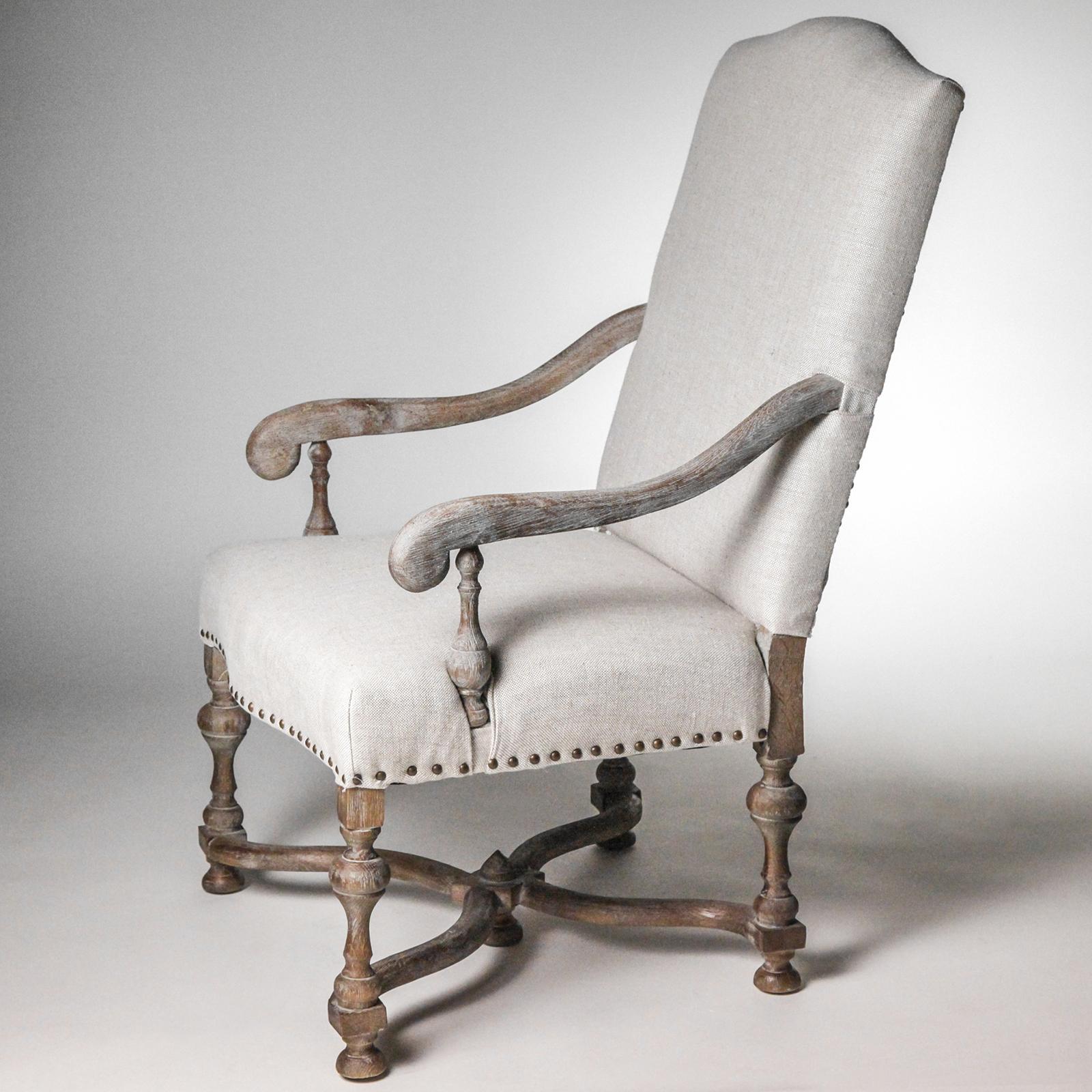 Traditional Oxford style chair with carved and scrolled arms, legs and stretcher. Natural linen fabric seat and back.
