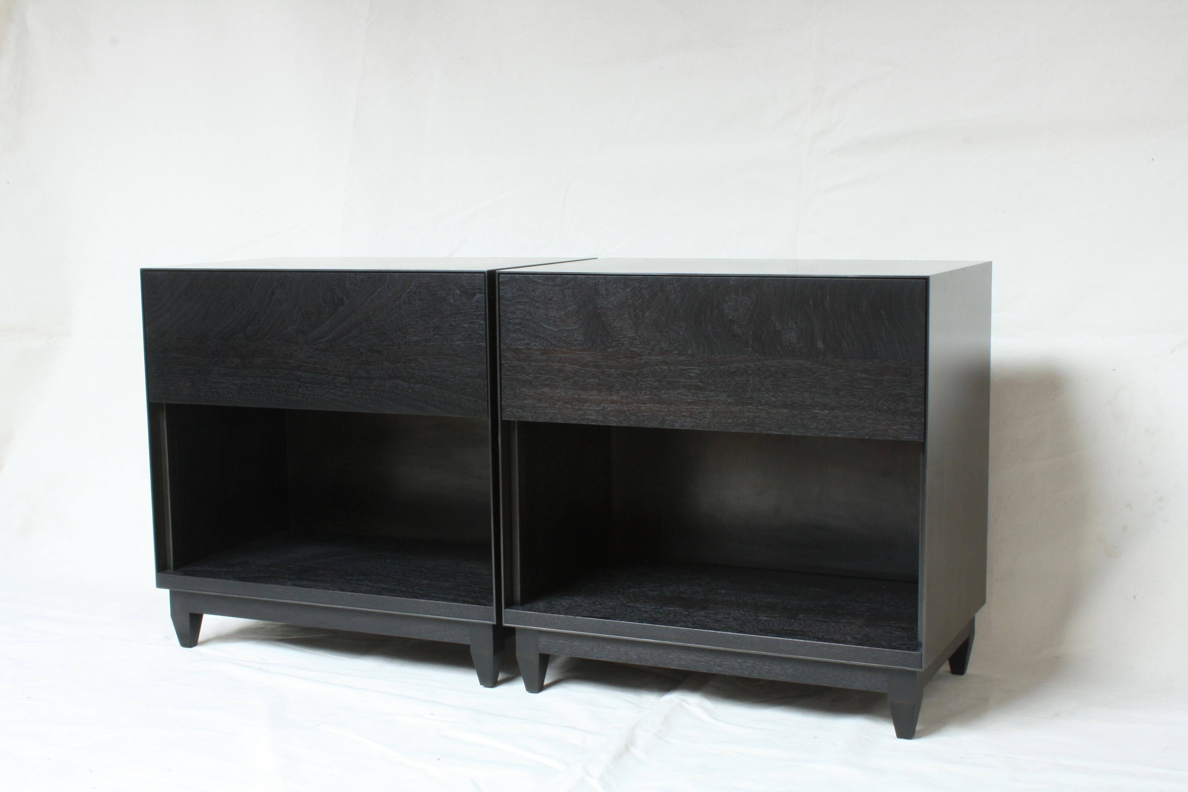 Handmade in Chicago by Laylo Studio, this customizable nightstand or side cabinet features a blackened steel case and a solid wood interior, drawer front and base. The thin front edge of the seamless metal case frames a drawer front and dovetailed