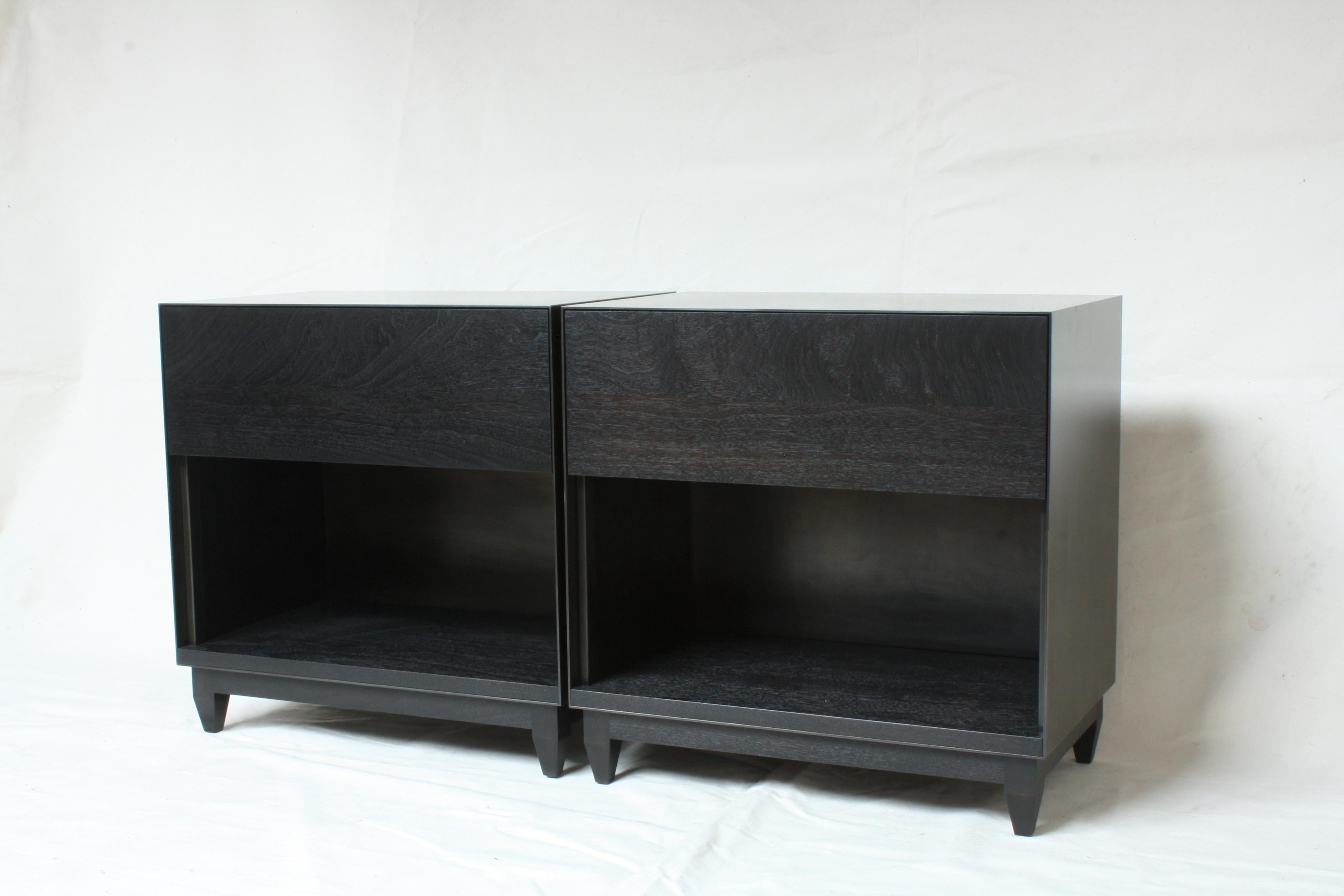 Handmade in Chicago by Laylo Studio, these customizable nightstands or bedside tables feature a blackened steel case and a solid wood interior, drawer front and base. The thin front edge of the seamless metal case frames a drawer front and