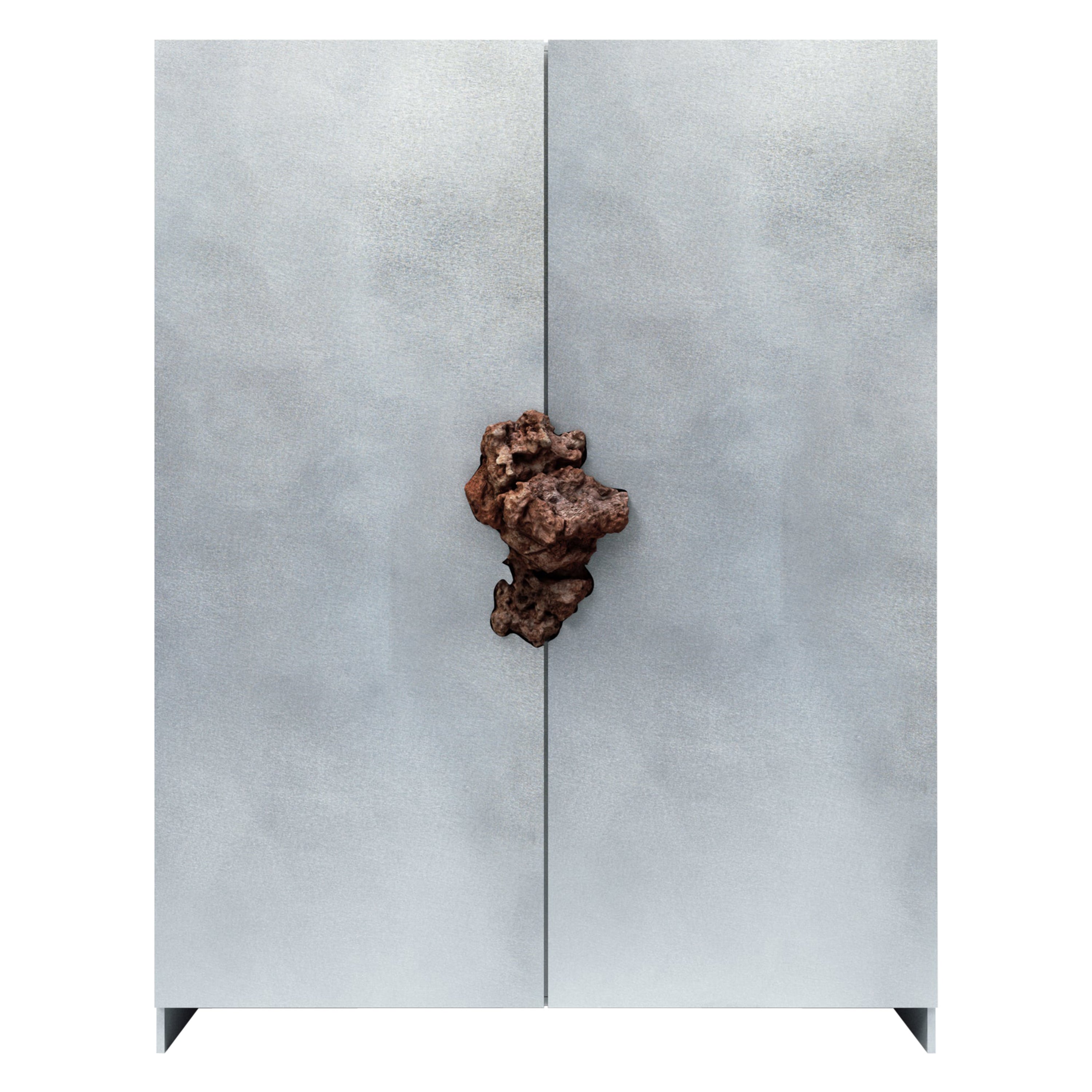 Petit meuble en aluminium oxydé et ciré avec pierre de lave de Pierre De Valck