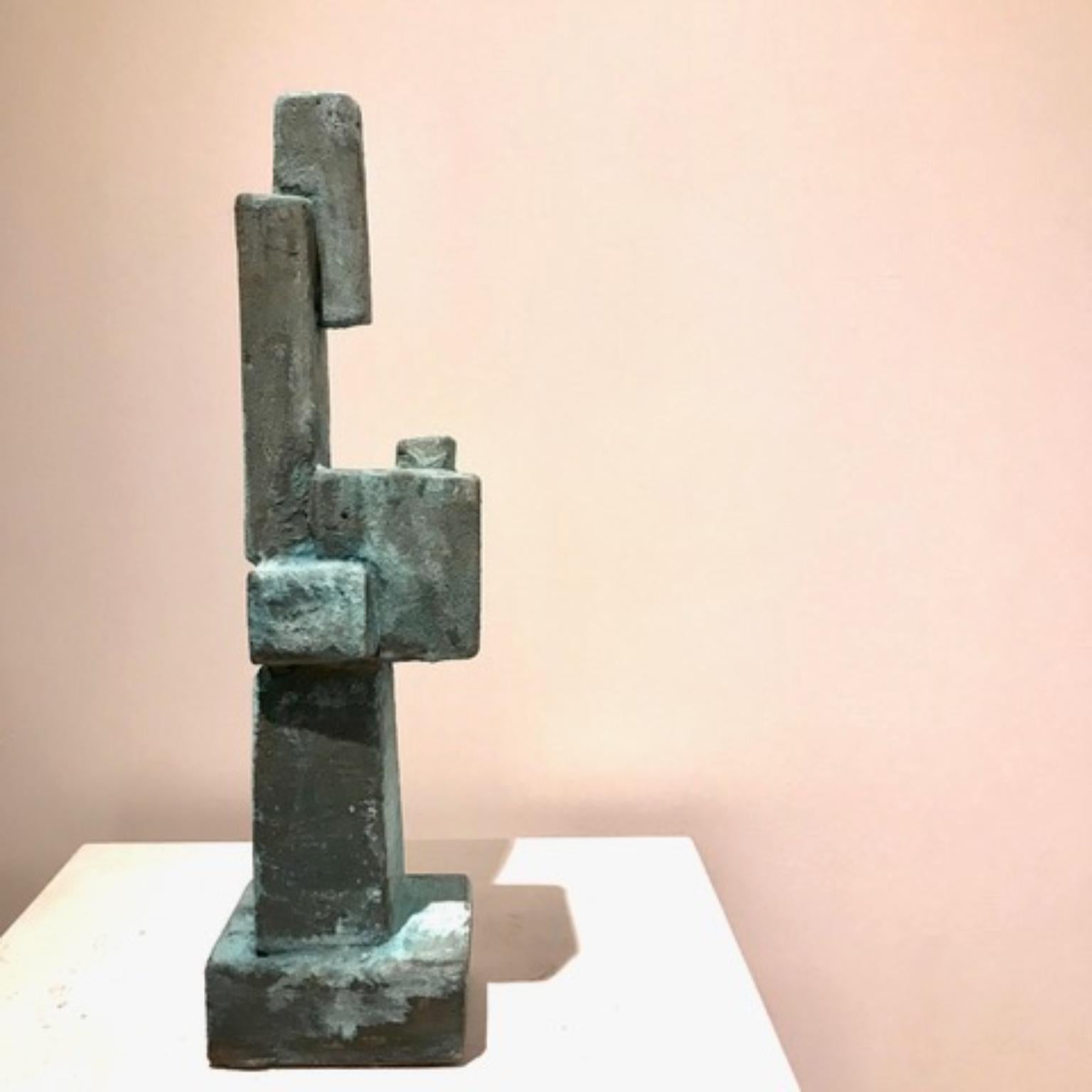 Oxidized bronze Green Blue Metallized Mini Totem by Frederic Texier
Dimensions: W 10 x D 12 x H 43 cm. 
Materials: Concrete coated with bronze powder and then oxidized.
Color: Oxidized bronze (green blue)

Artist Frédéric Texier expresses a passion