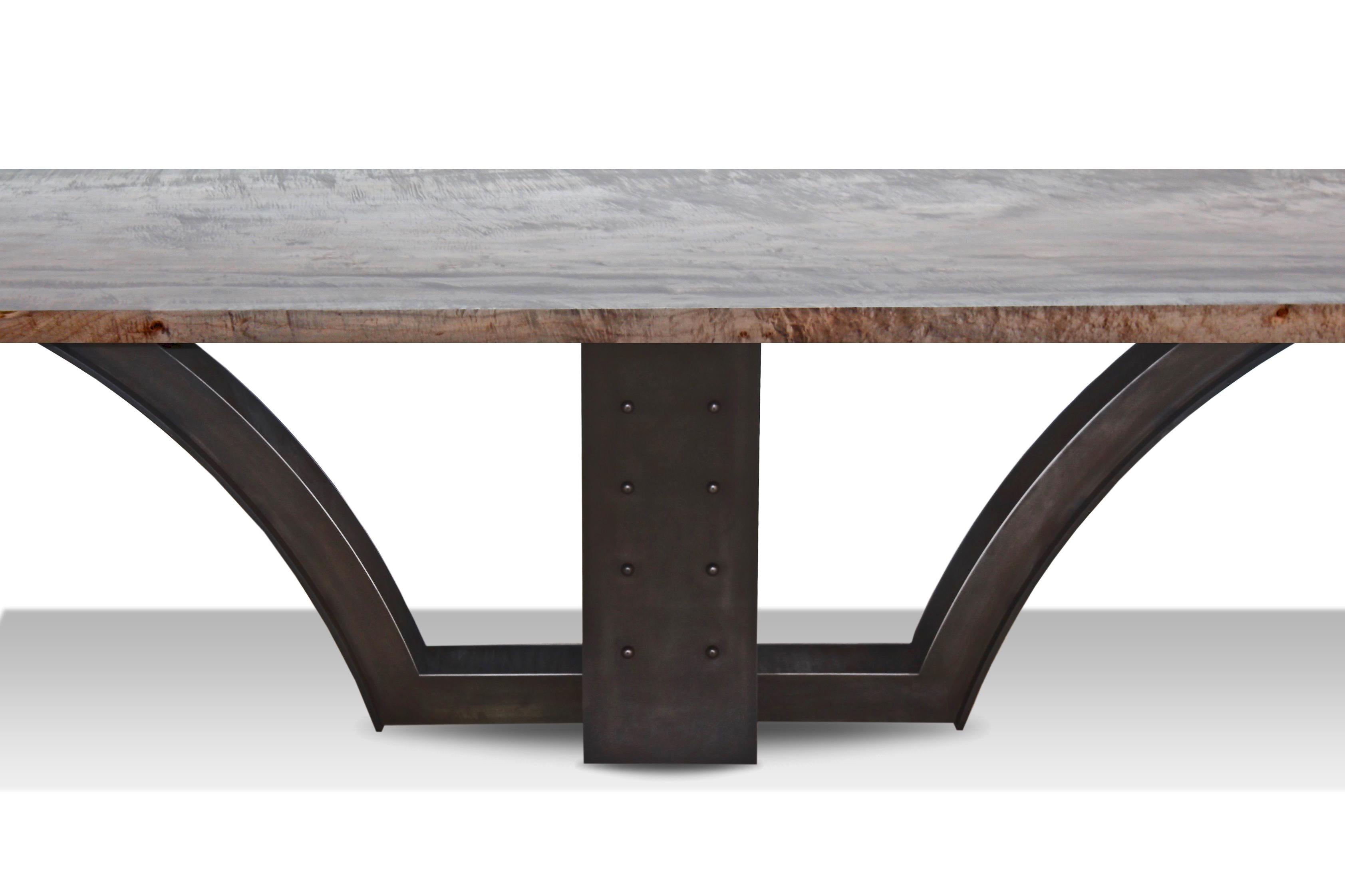 A centrepiece of the Mark Jupiter signature collection, this slab dining table is shown in oxidized maple on our Bridges base - inspired by the classic architecture and bridge design of our home city. 

A wide variety of slabs and finishes are