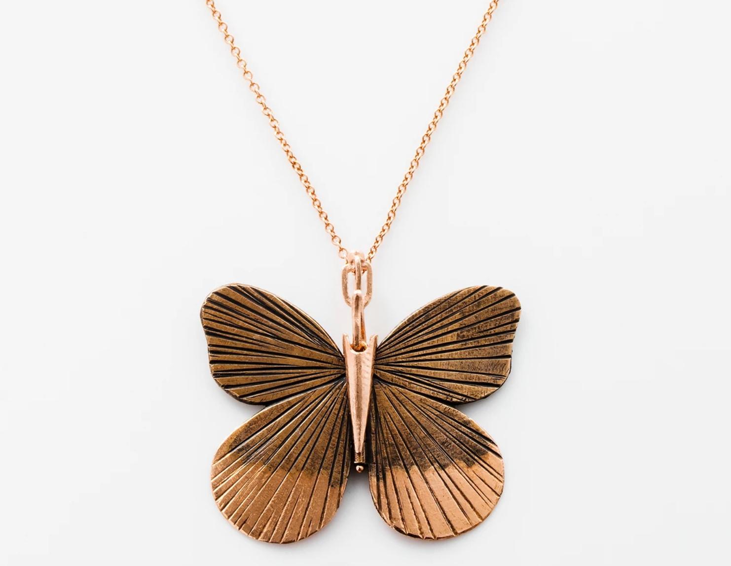 James Banks's signature butterfly necklace features a Large Asterope butterfly with a hinge at the center to allow movement of the wings, set in Oxidized Rose Bronze and 14k Rose Gold hung on a 14k Rose Gold chain, with a secure clasp closure.