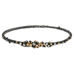 Oxidized Silver, 22K Yellow Gold & Diamond Dark Gleam Bangle by Agneta Bugyte