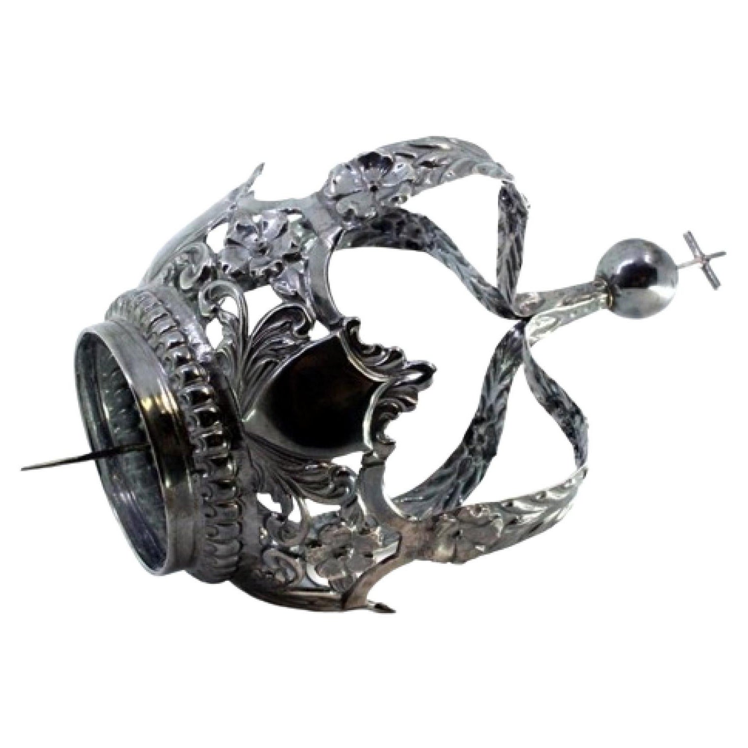 Oxidized silver Marian crown with cutouts and raised floral motifs, cross top