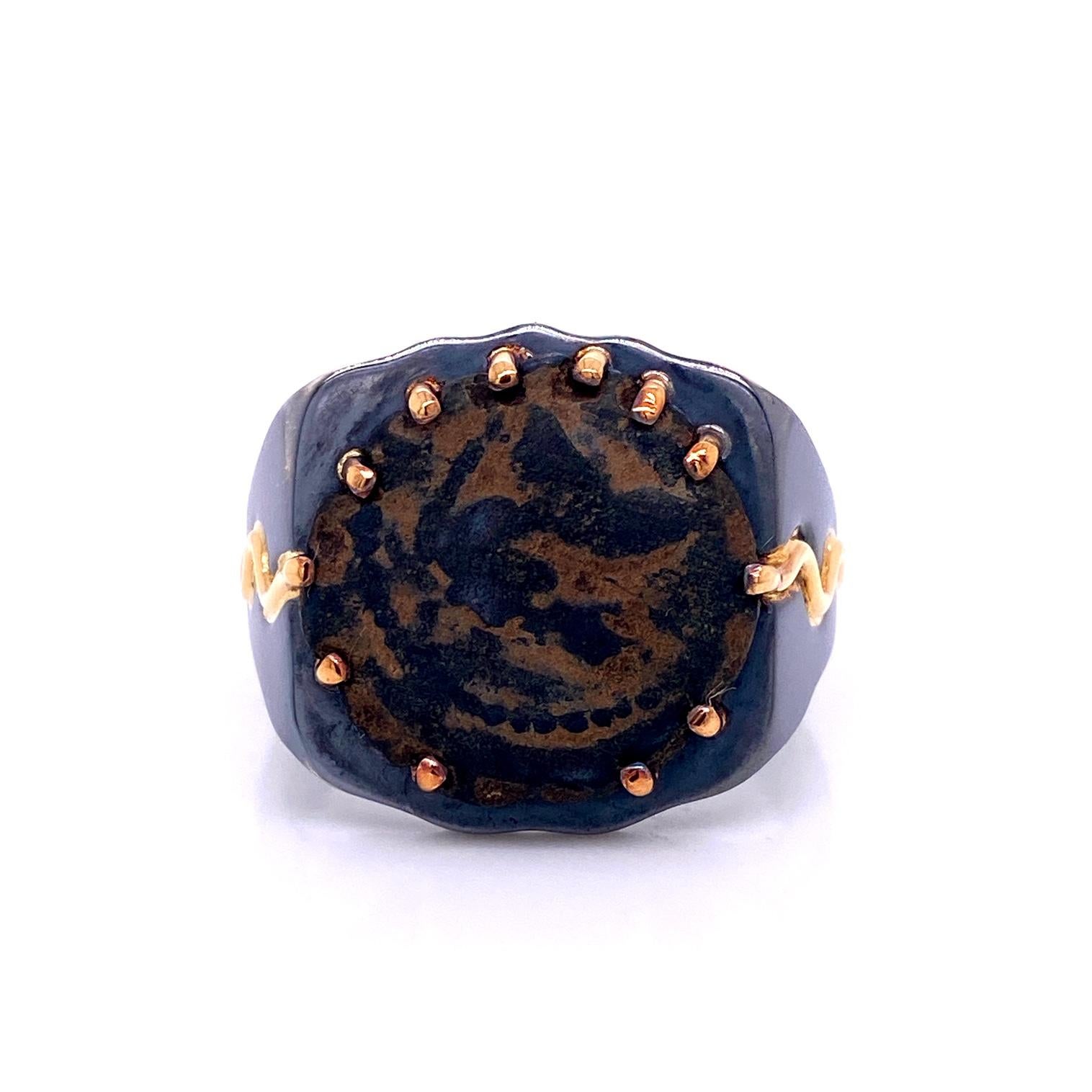 An 18k yellow gold and oxidized sterling silver men's ring set with an Ancient Roman Coin. Ring size 10.5. This ring was made and designed by llyn strong.