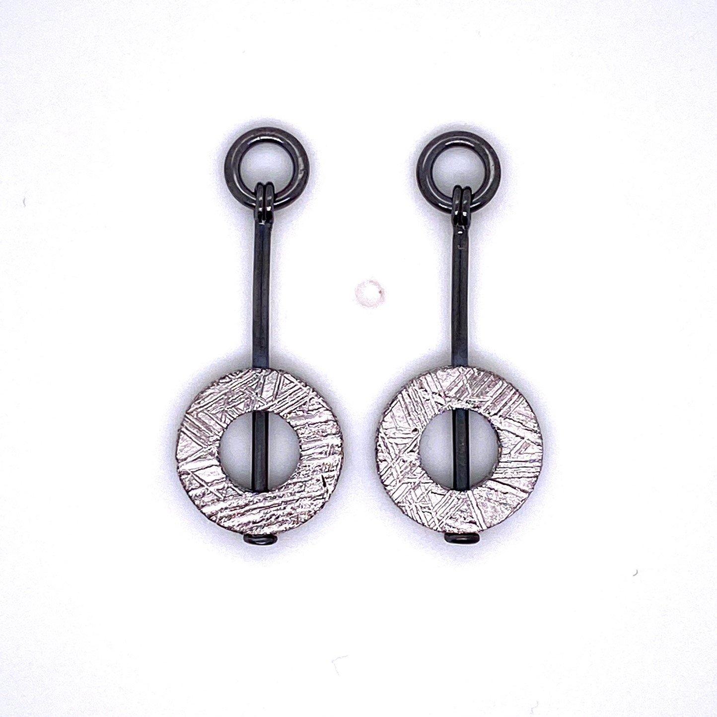 A pair of sterling silver scroll studs with 18k yellow gold, with a pair of donut shaped meteorite jackets, made in oxidized sterling silver. These earrings were made and designed by llyn strong.

Items sold separately upon request.