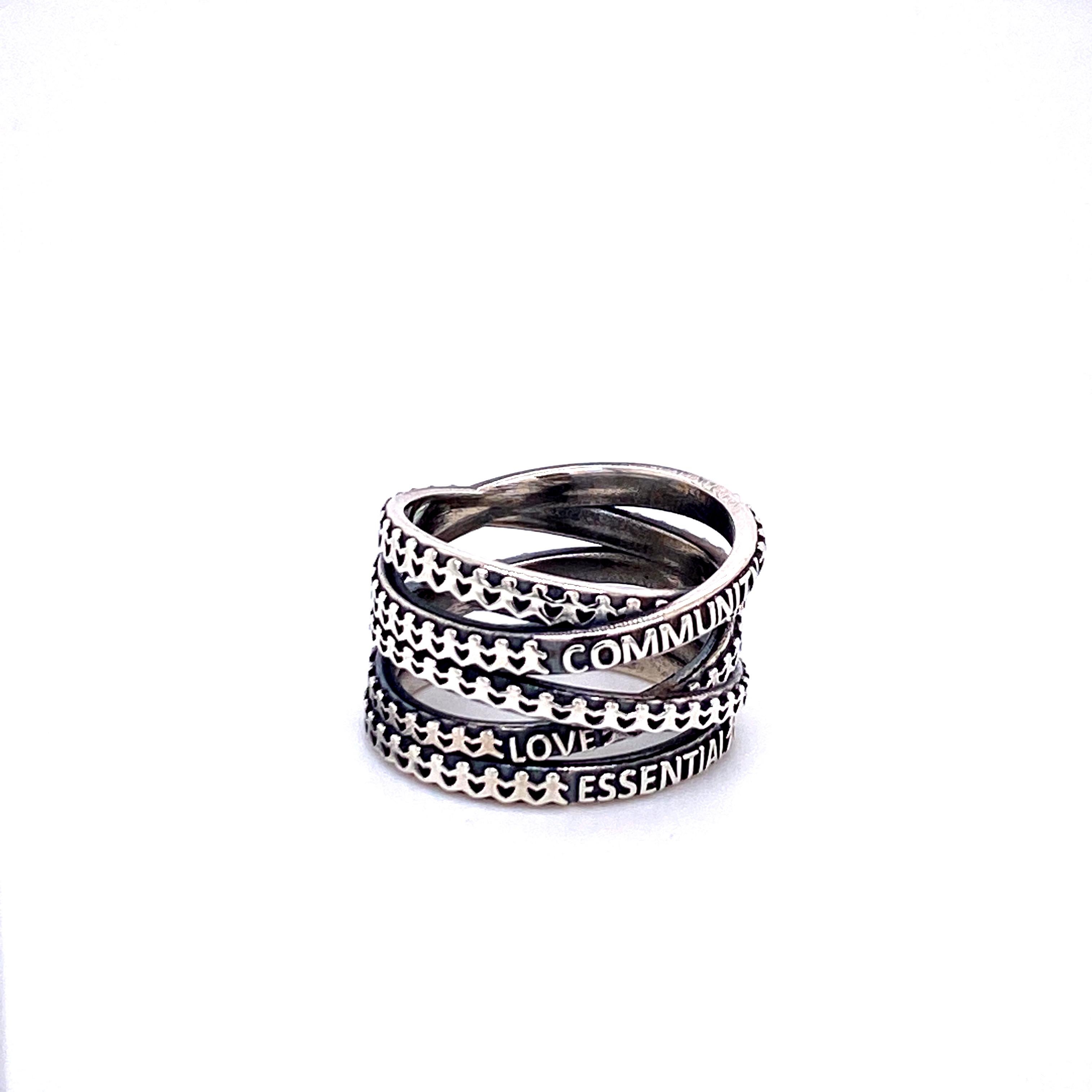 A narrow Not Non-Essential ring in oxidized sterling silver. This ring is a size 8. This ring was designed and made by llyn strong.

Due to the width of this ring it is recommended to order a half to full size larger than your usual ring size.