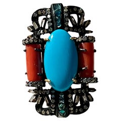Anillo de plata de ley oxidada con turquesa, coral y diamantes