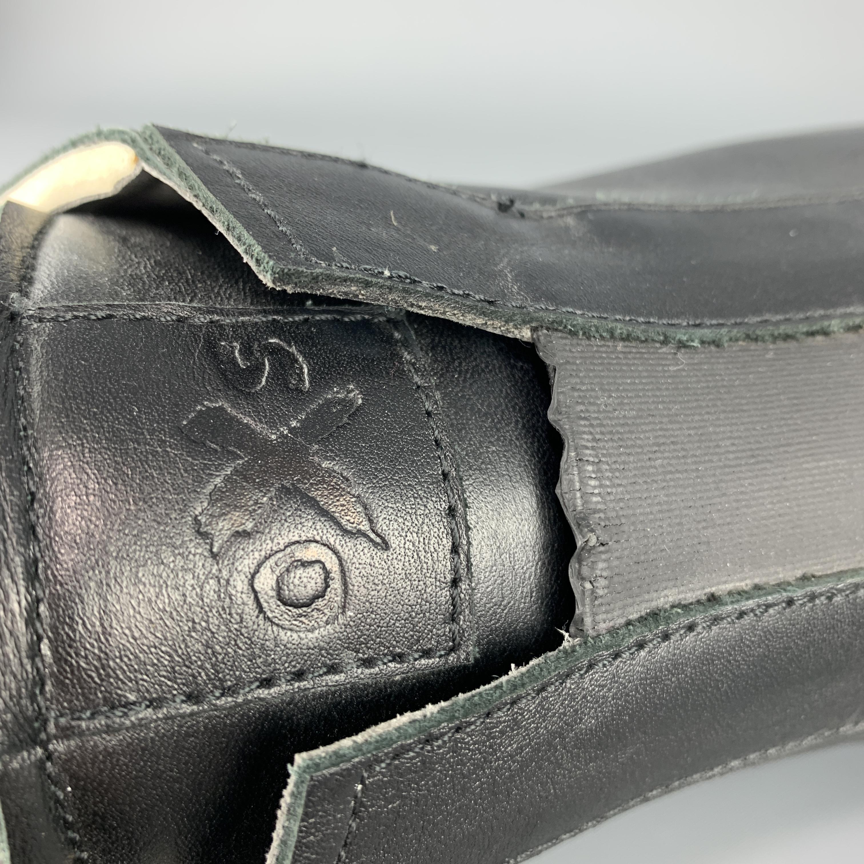 O.X.S. sneakers come ijn black leather with a slip on elastic front and dipped chunky rubber platform sole. Made in Italy.

Good Pre-Owned Condition.
Marked: IT 44

Outsole: 12 x 4 in.