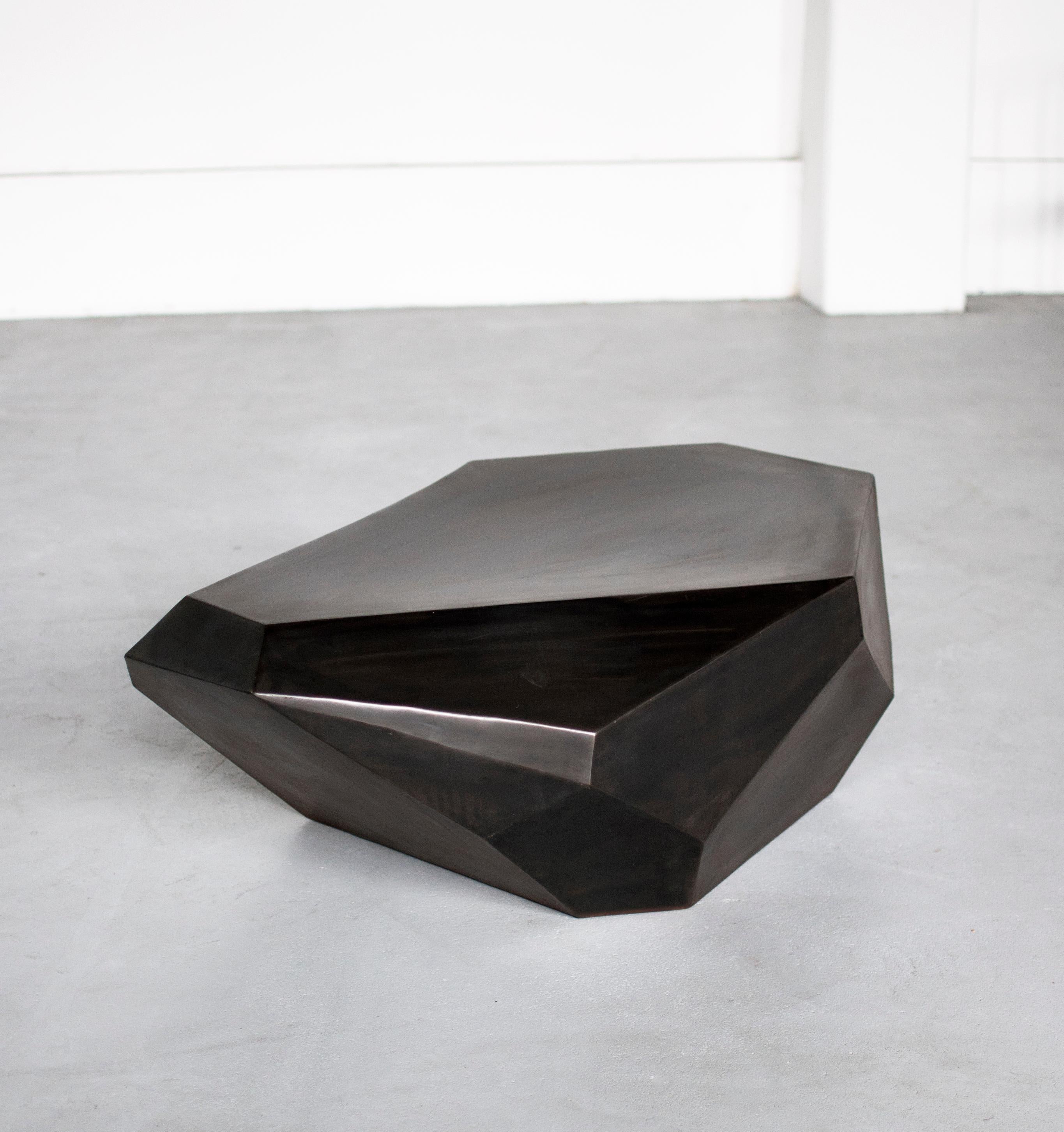 Oxyde Table by Pol Quadens 
Limited Edition Of 8+4 Pieces.
Dimensions: D 90 x W 105 x H 35 cm.
Materials: Black patinated steel.

Pol Quadens was born in Brussels. His father was active in the fields of composites the metal industry, and the world