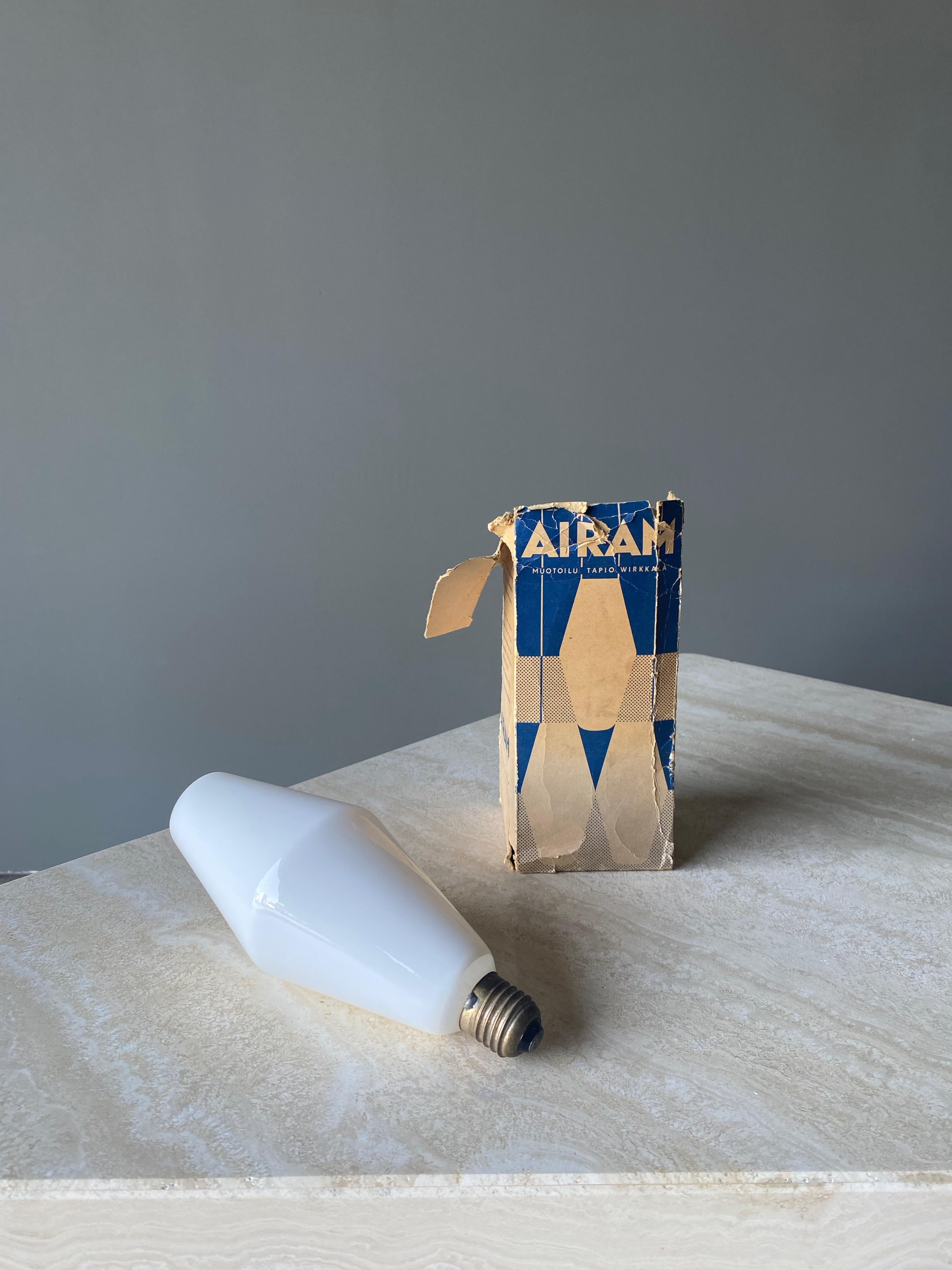 Oy Airam Ab, LIghtbulb By Tapio Wirkkala, 1960. Comes in original box, box shows wear and loss of material. lightbulb is in mint working condition. 
Dimensions of the lightbulb are 3 1/8'' wide by 8 '' tall.