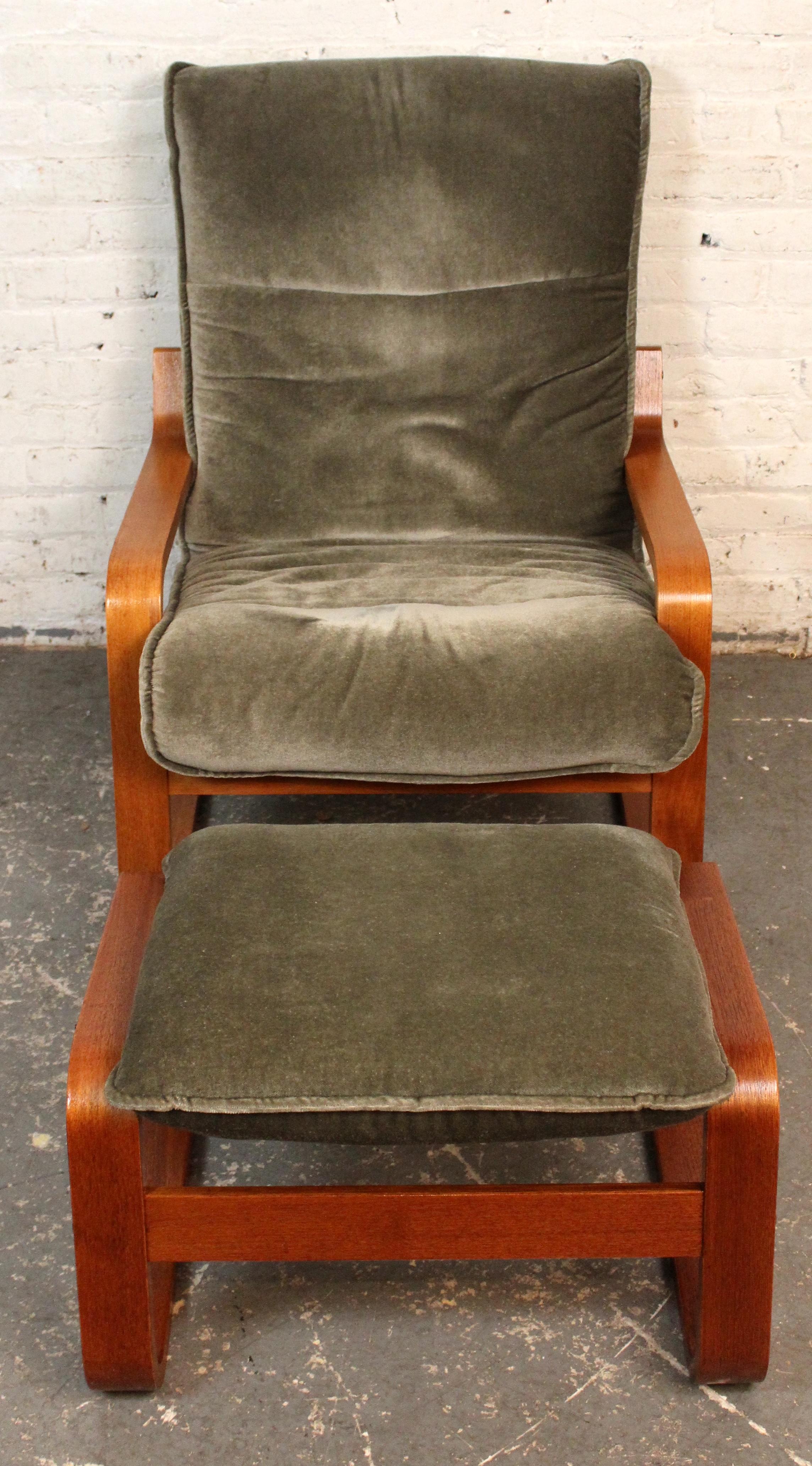 A sleek and sculptural Danish modern lounge chair, this vintage bentwood armchair features a cantilevered teak frame with flowing lines and ergonomic comfort. Paired with its matching ottoman, the set offers a perfect balance of form and