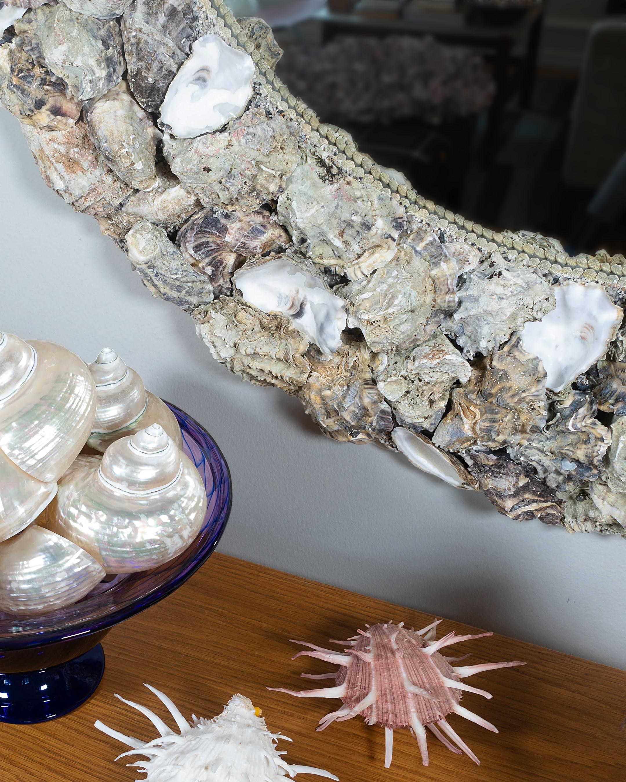 The Shellman oyster shell mirrors are among the most popular from shell artists Mikael and Buster. They manage to present edgy roughness and pure elegance at the same time. At first glance it may look beige only, but in an oyster shell you will find