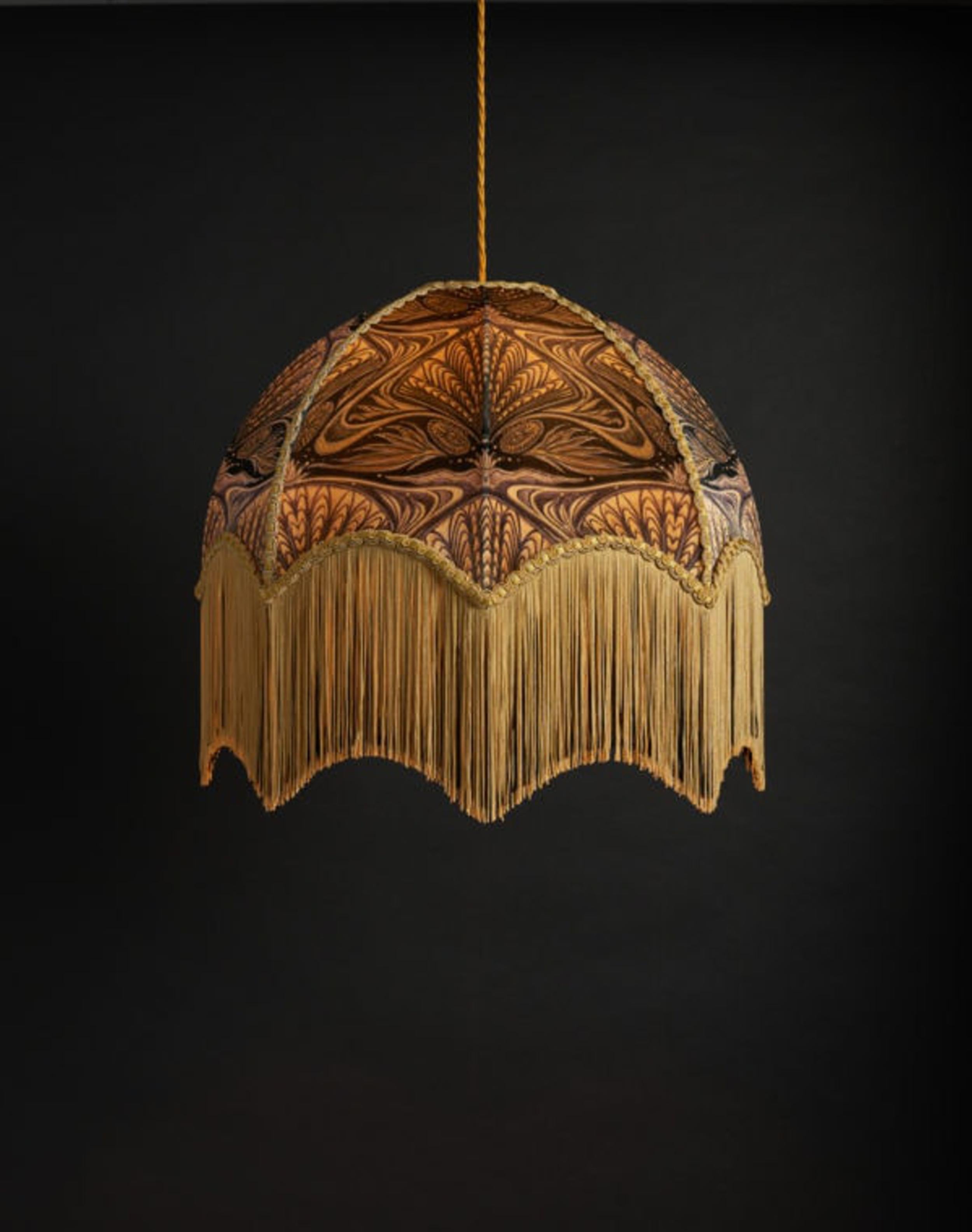 Oyster is our Art Nouveau inspired design, with an intricate and complex pattern in golds, soft blacks and a slightly purplish hue.

Anna Hayman lampshades create a fantastic centrepiece to a room and work as well on a lamp base as they do as