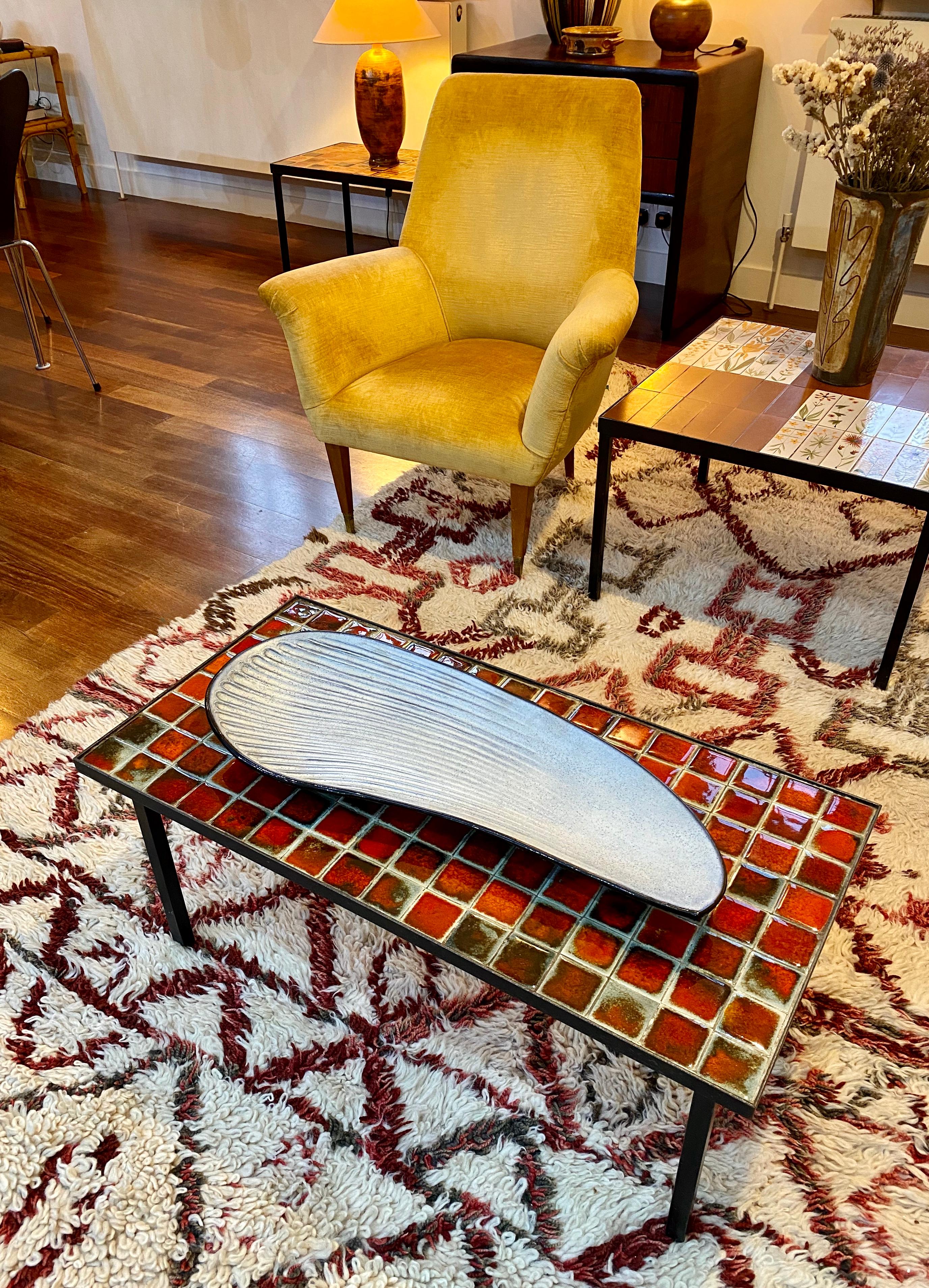Oyster shell-shaped ceramic platter by French ceramicist, Marcel Guillot (circa 1960s). An impressively large platter with speckled, matt, off-white interior surface with tactile ridges such as those on an oyster shell. In contrast, the bottom