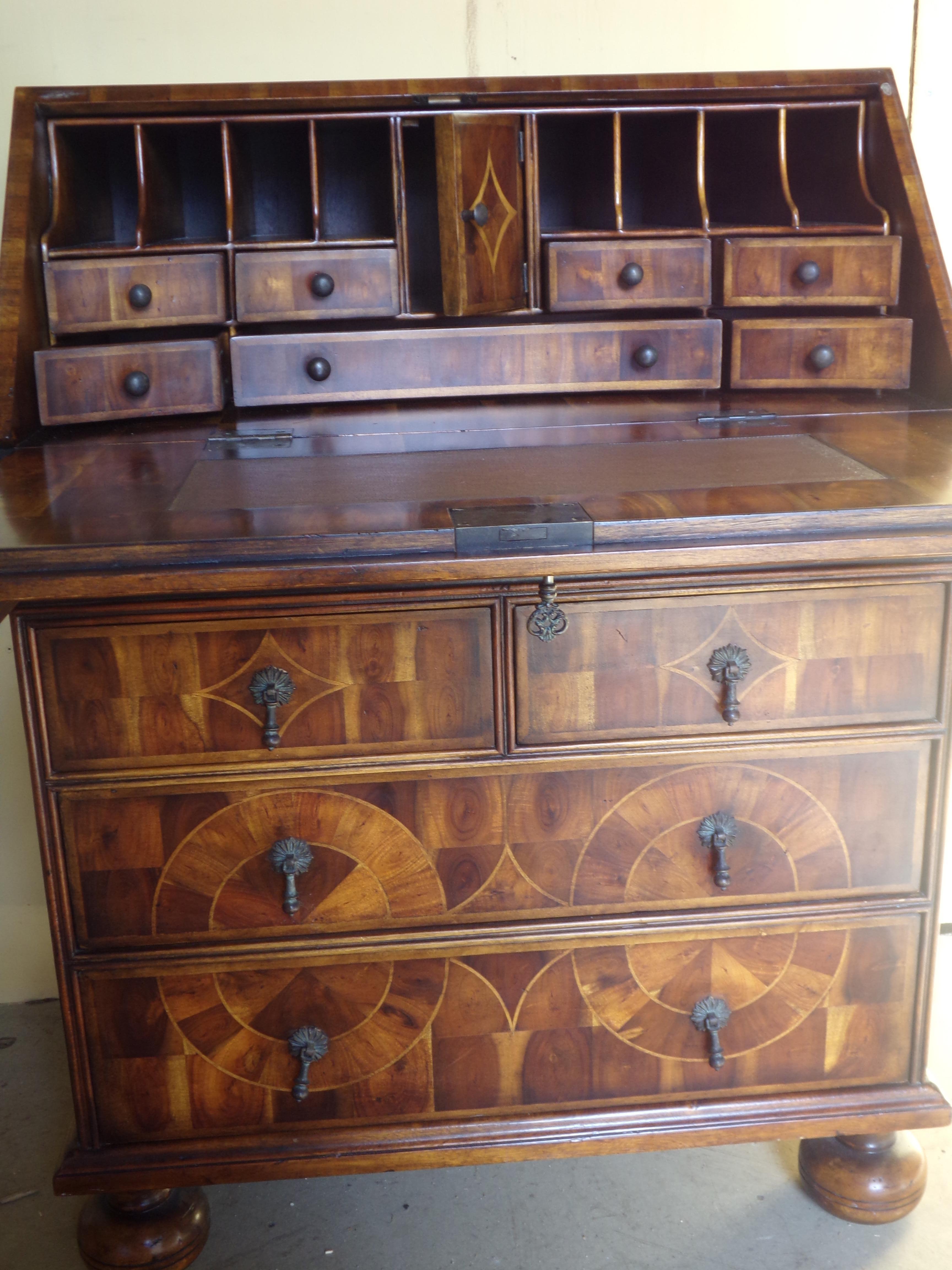 A stunning fall front George the first style bureau in Laburnum Oyster veneers with parquetry inlay, circa 1960. Beautifully reproduced by a master craftsman this fine bureaux will be the centre of attention in any room.
A chance to own a fine