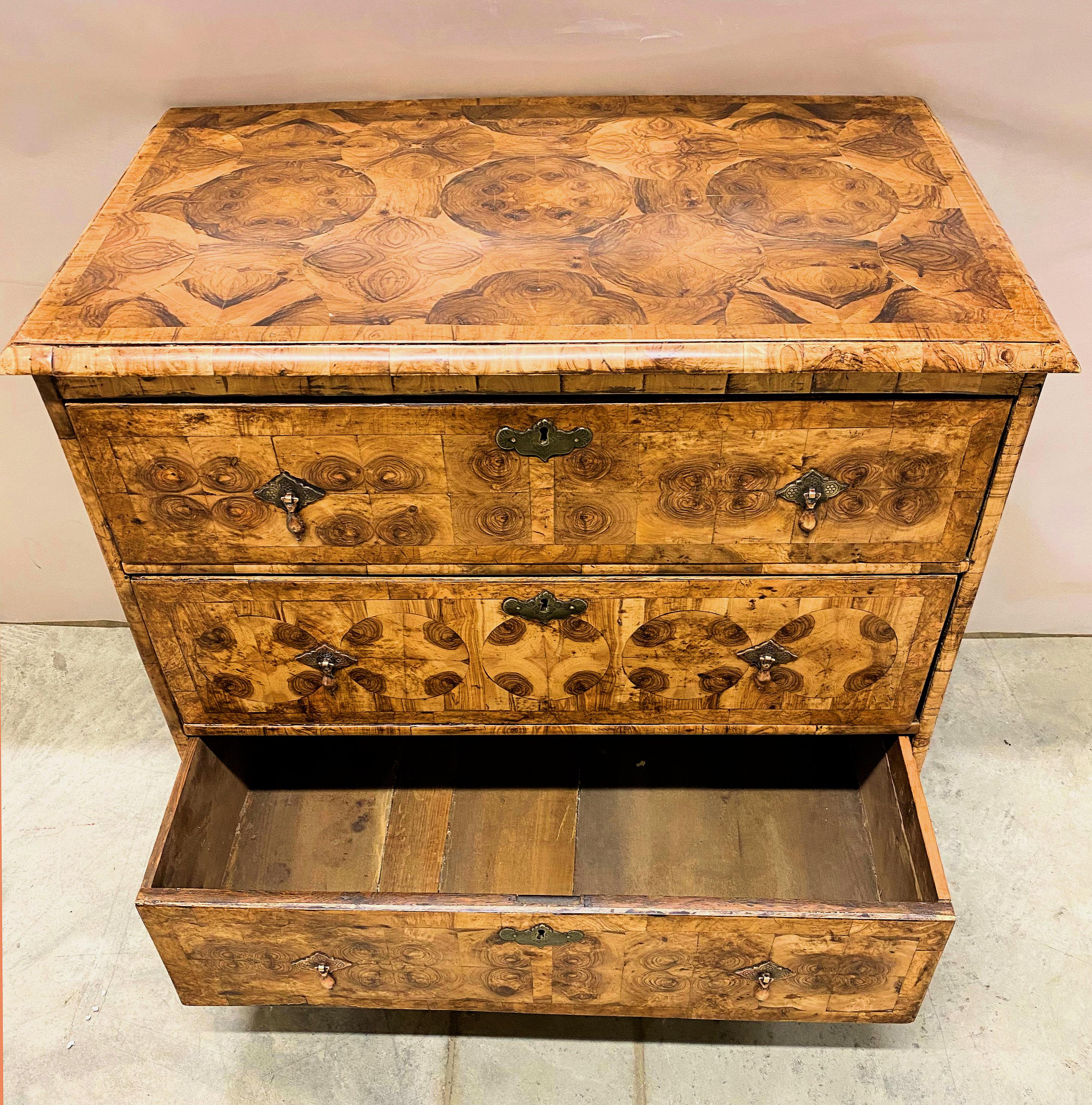 This beautiful and well proportioned mid 18th Century Chest of drawers has been very sympathetically re-veneered and has had the handles replaced. The chest itself is oak, and is dated to approximately 1740. The chest of drawers is comprised of 3