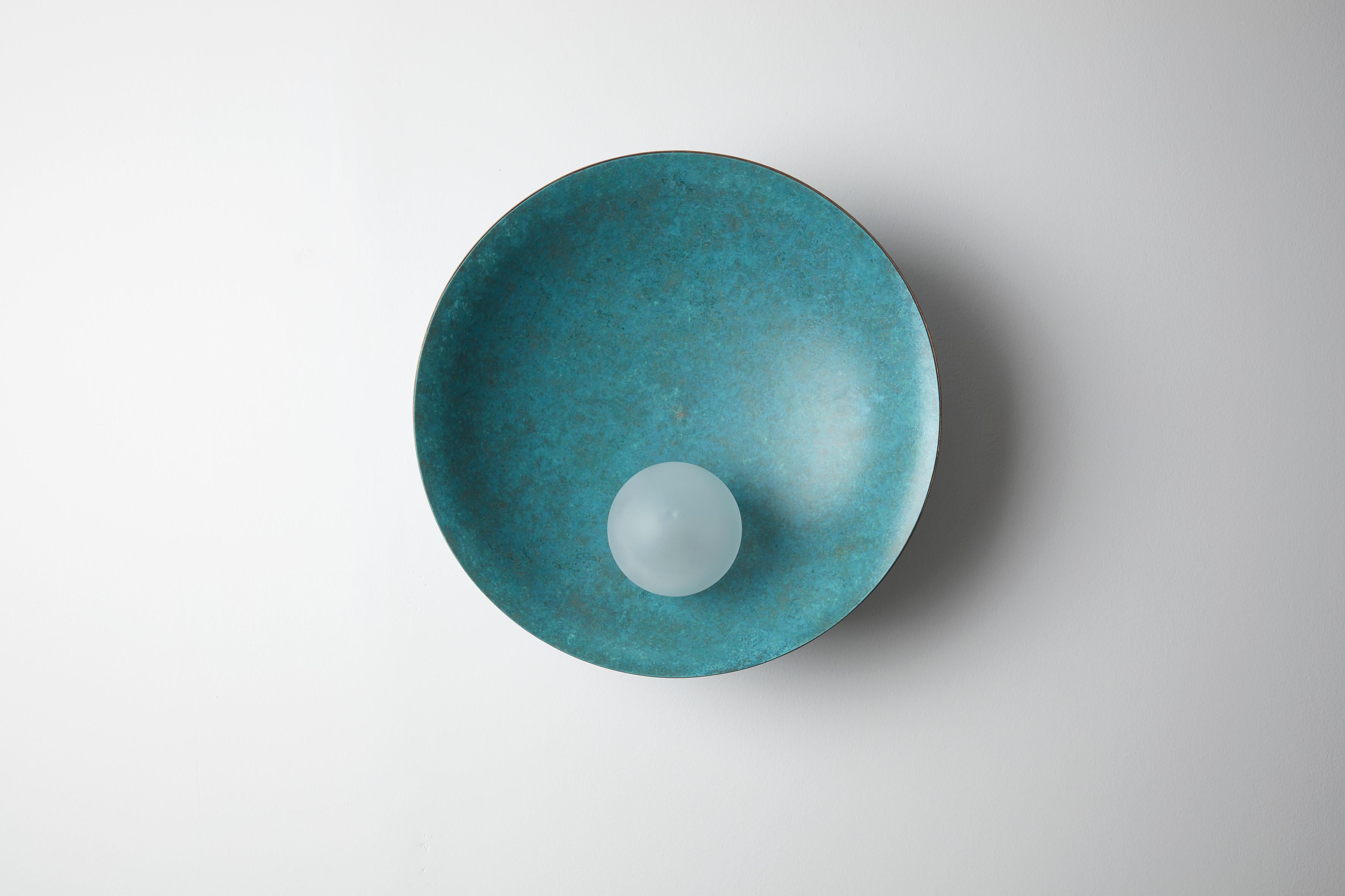 Oyster wall-ceiling mounted Verdigris, - Carla Baz
Dimensions: ø 40 x D 18 
Weight: 3.5 kg
Material: Brass, blown satin glass globes

Oyster is a series of sculptural lighting pieces that were developed in 2016. Wanting to explore the idea of