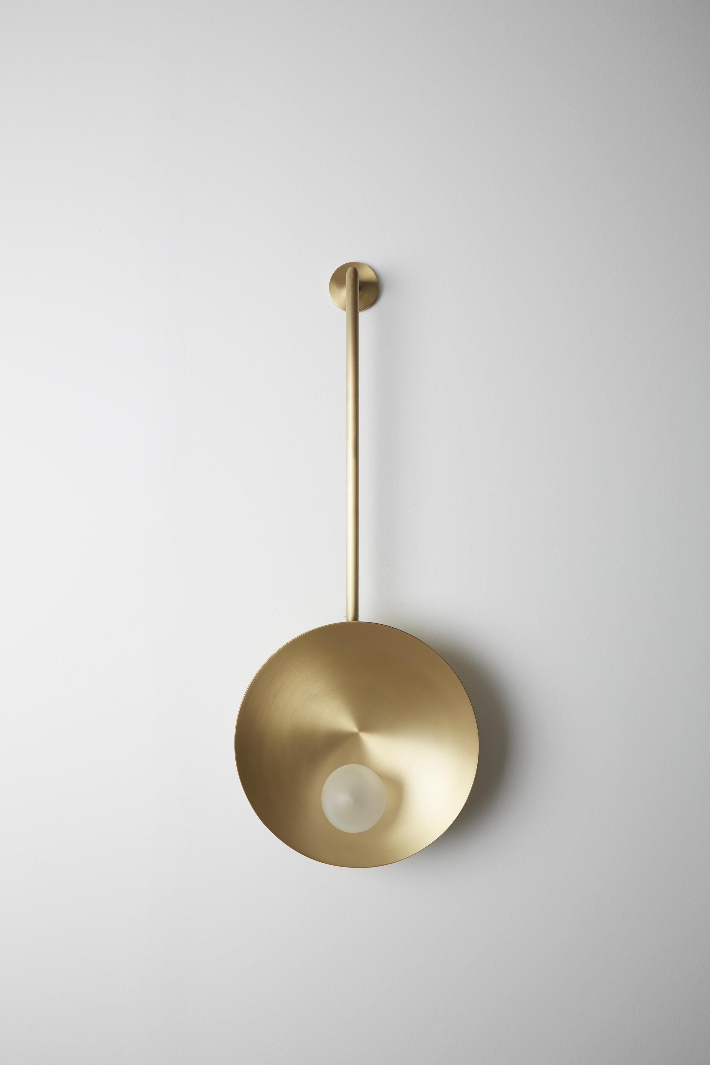 Oyster wall mounted brass, Carla Baz
Dimensions: ø 30 x H 78 x D 14 cm
Weight: 2 kg
Material: Brass, blown satin glass globes

Oyster is a series of sculptural lighting pieces that were developed in 2016. Wanting to explore the idea of customization