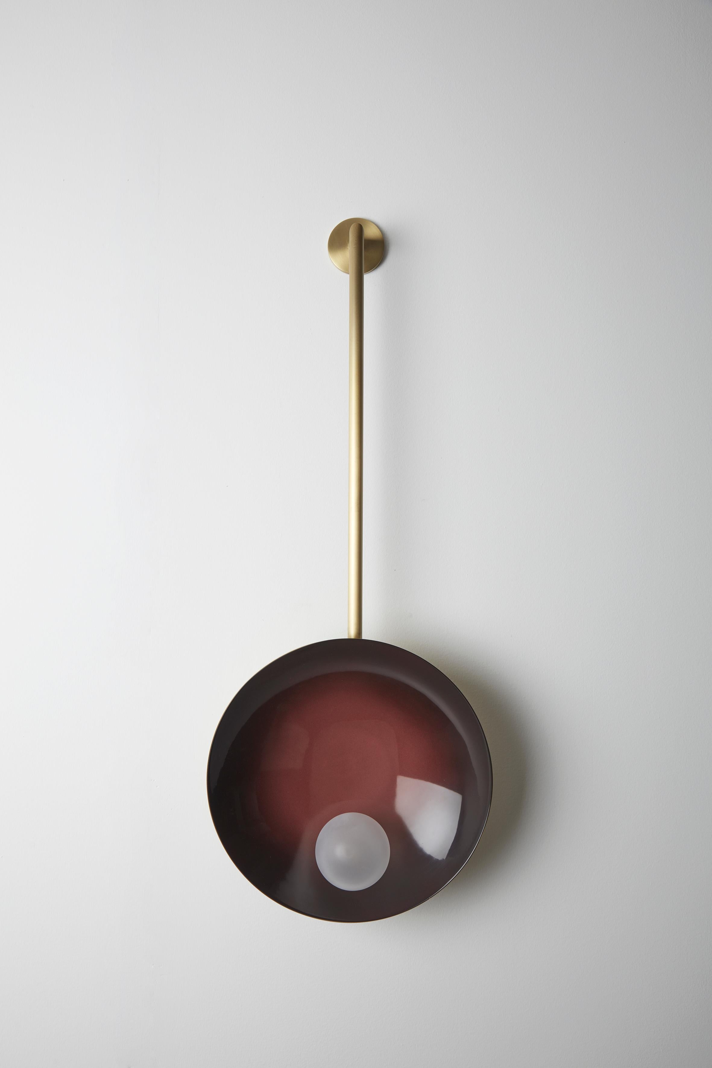 Oyster wall mounted burgundy, Carla Baz
Dimensions: ø 30 x H 78 x D 14 cm
Weight: 2 kg
Material: Brass, blown satin glass globes

Oyster is a series of sculptural lighting pieces that were developed in 2016. Wanting to explore the idea of