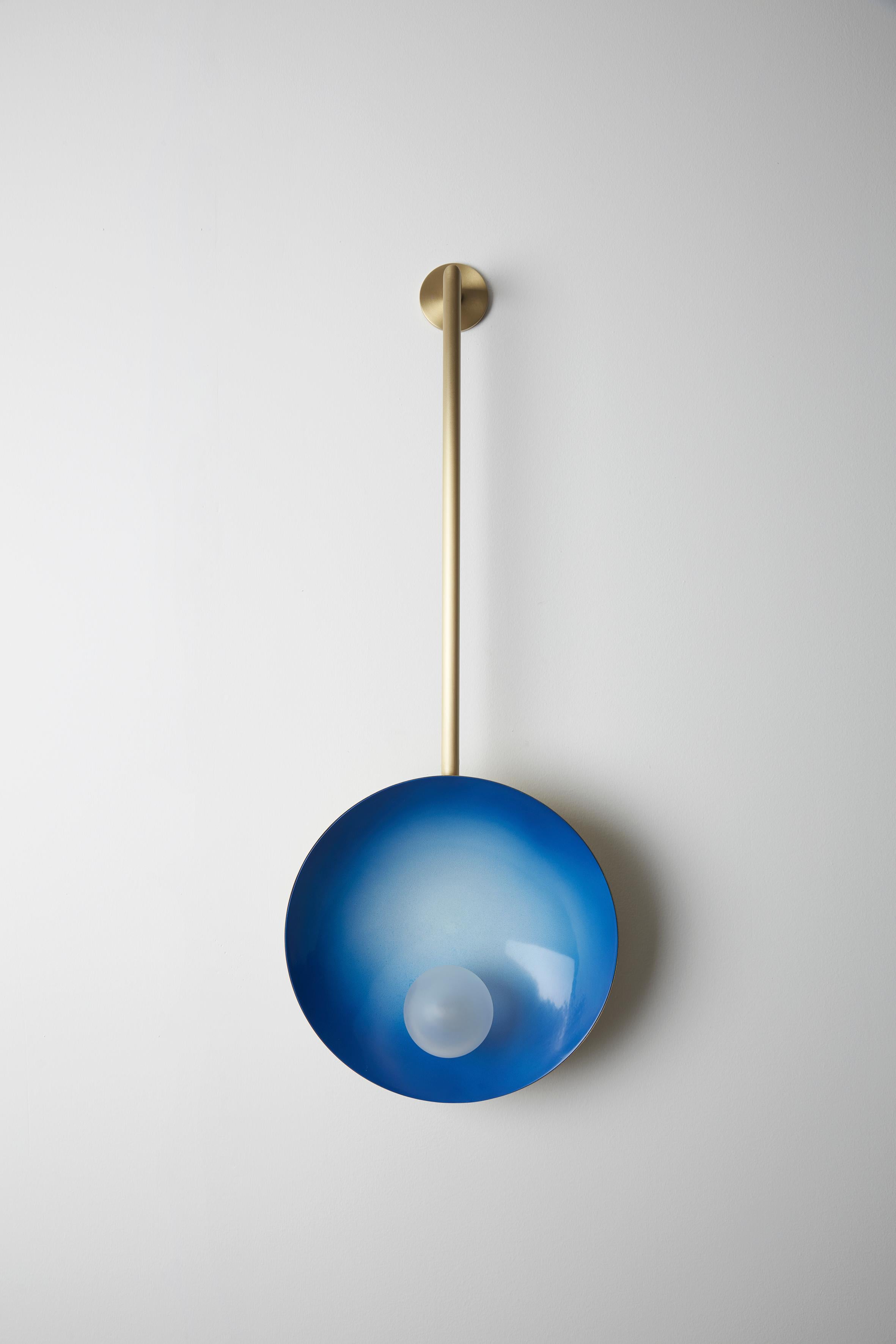 Oyster wall mounted electric blue, Carla Baz
Dimensions: ø 30 x H 78 x D 14 cm
Weight: 2 kg
Material: Brass, blown satin glass globes

Oyster is a series of sculptural lighting pieces that were developed in 2016. Wanting to explore the idea of