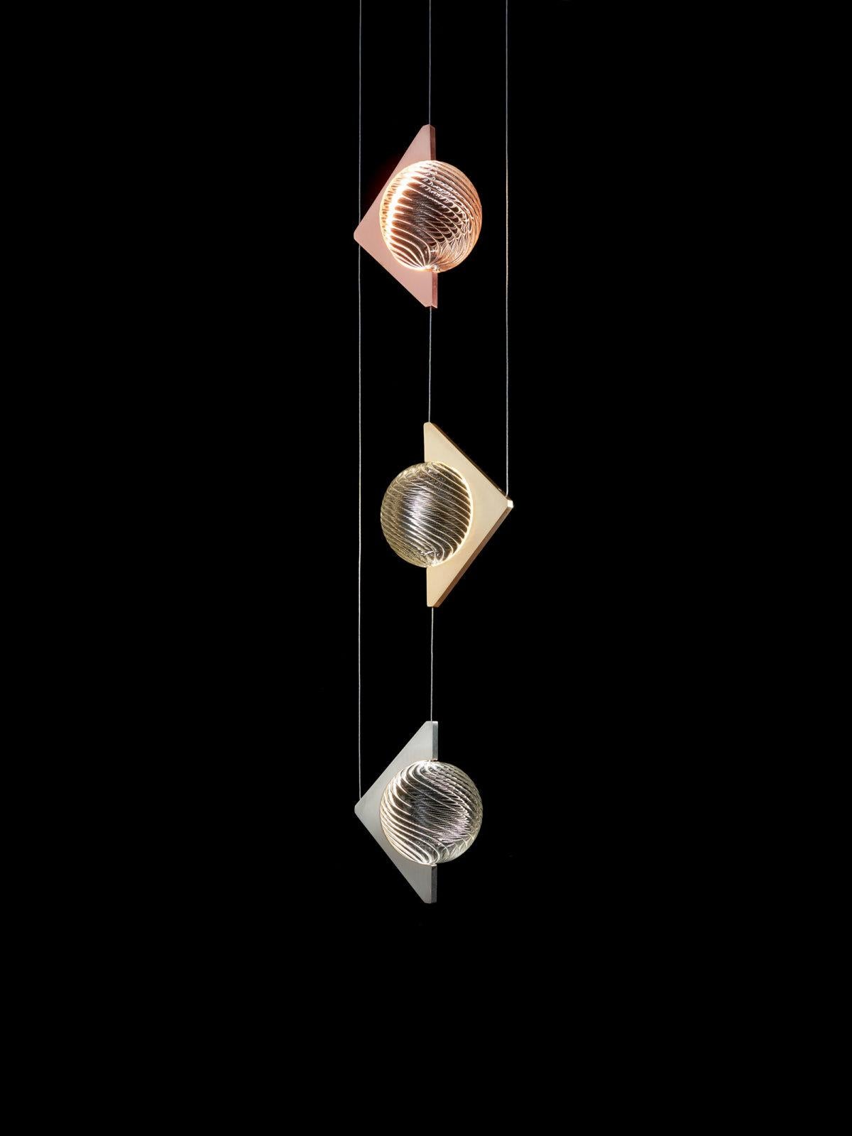 Oz 3 Lights Pendant Lamp by Aggiolight
Dimensions: D 28.5 x W 20 x H 200 cm. 
Materials: Satin rose gold-plated metal, satin brass, satin stainless steel, mouth-blown twisted glass.

Also available with one single module. Please contact us.

All our