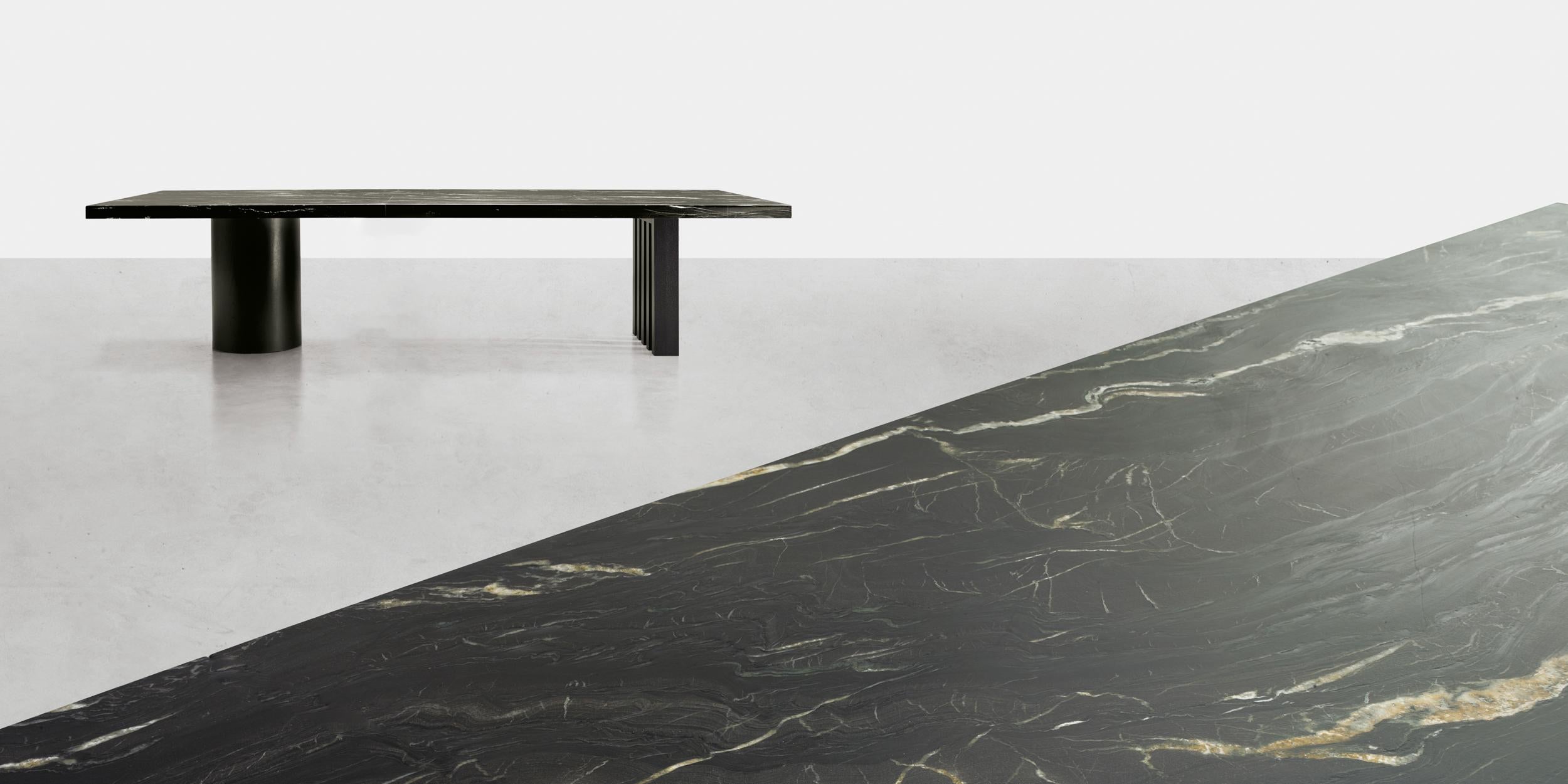 The table, in rectangular and round versions, is inspired by the spectacular landscape of the U.S.
Ozarks mountain range region: forests of towering trees with regular, straight trunks tend upward in contrast
to the horizontal placidity of the lake.