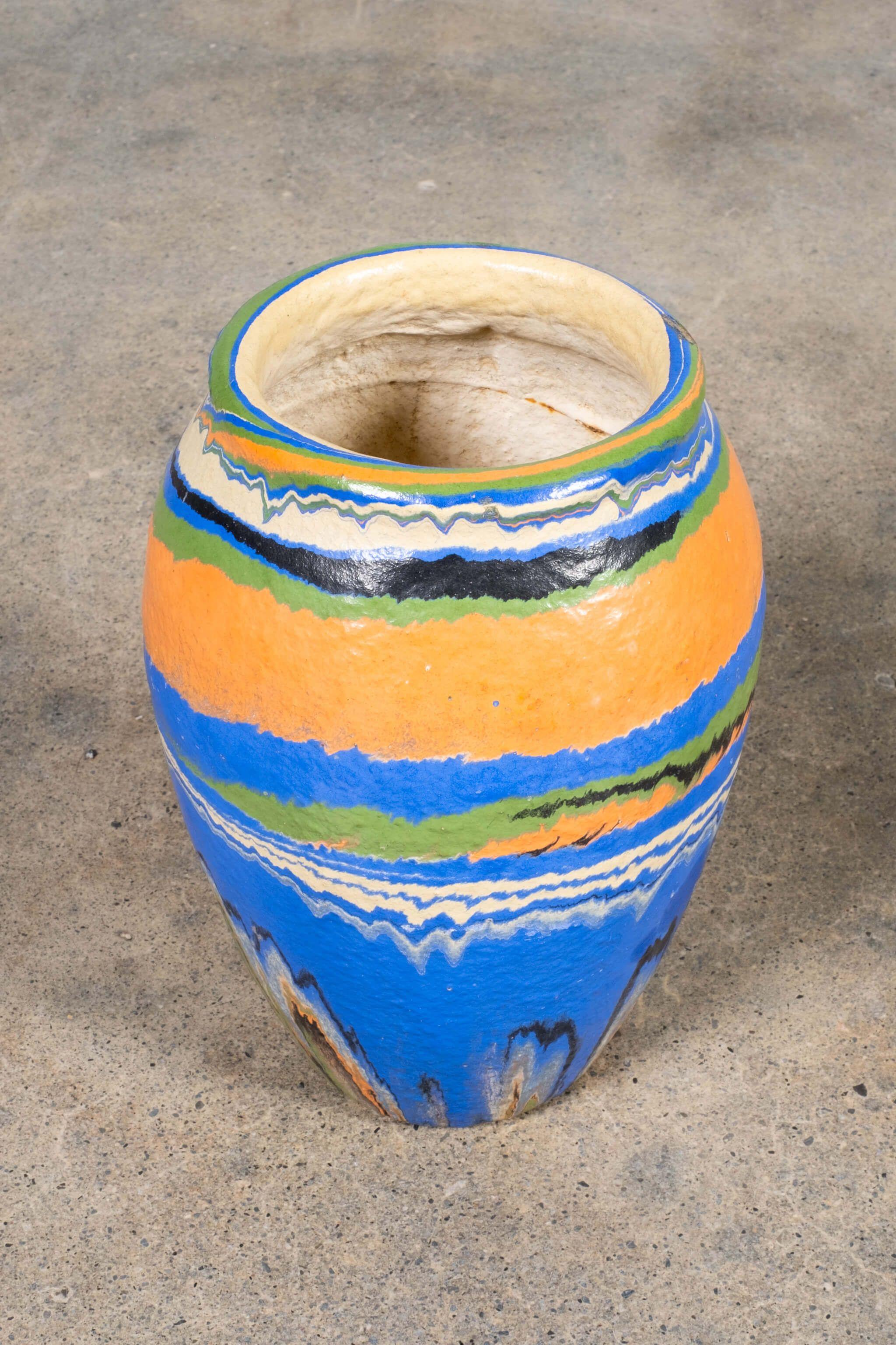 Tall Blue + Multi Vase

ABOUT OZARK ROADSIDE POTTERY
“Ozark pottery” refers to several mid-century American pottery makers that artificially coloured clay then turned pieces with marbleized swirls on the potter's wheel. Some makers include Ozark,